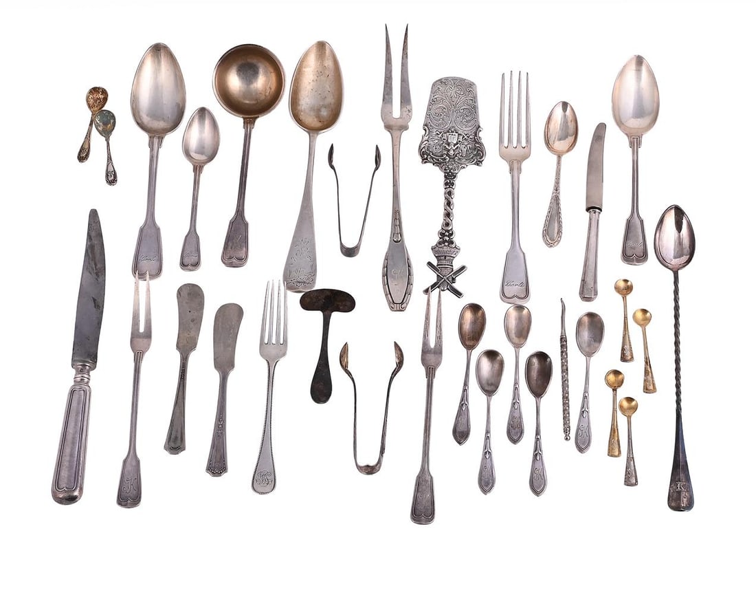 A GROUP OF MISCELLANEOUS GERMAN .800 STANDARD FLATWARE AND ELECTRO-PLATED ITEMS: A GERMAN SILVER CARVING FORK POST 1886 .800 STANDARD Engraved GK 26cm long Together with: A GERMAN SILVER SERVING SLICE MAKER'S MARK GD OVER H, POST 1886. 800 STANDARD With a windmill terminal,