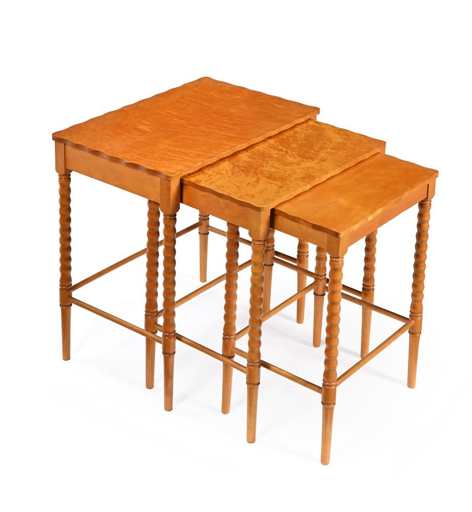 A NEST OF THREE GOLDEN SYCAMORE INTERSLIDING OCCASIONAL TABLES, 20TH CENTURY: A NEST OF THREE GOLDEN SYCAMORE INTERSLIDING OCCASIONAL TABLES 20TH CENTURY Each on bobbin turned legs 55cm high, 47cm wide, 32cm deep Condition Report: PLEASE NOTE: ALL LOTS ARE LOCATED AT SACKVILLE