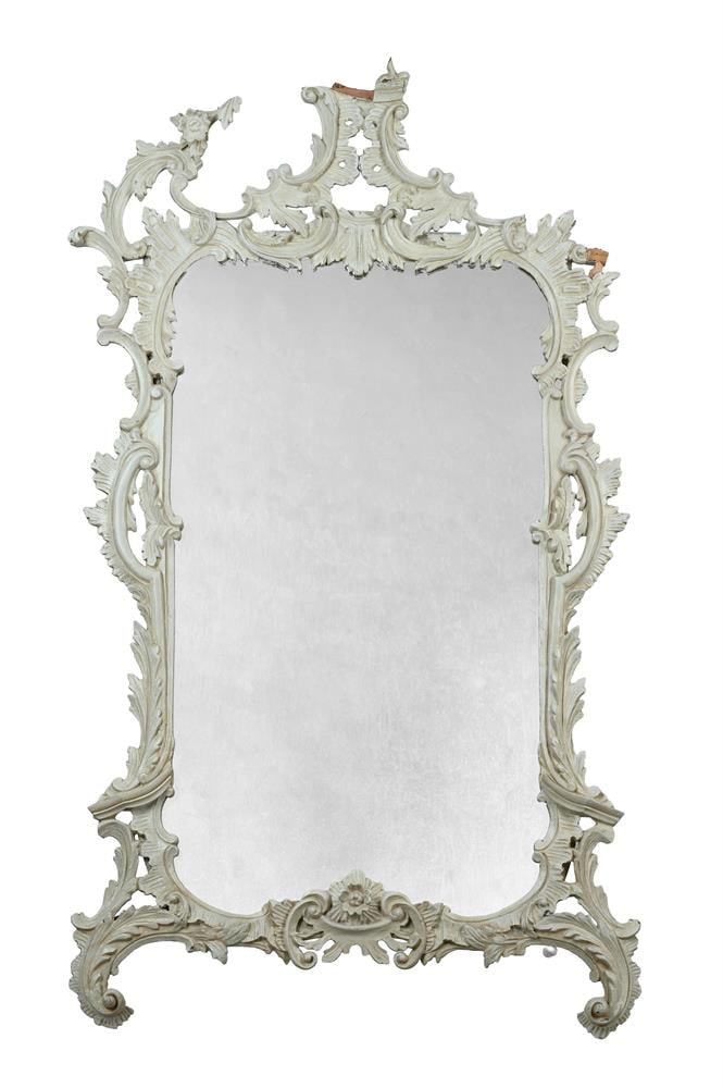 A CARVED AND PAINTED WOOD ROCOCO STYLE WALL MIRROR, 20TH CENTURY: A CARVED AND PAINTED WOOD ROCOCO STYLE WALL MIRROR 20TH CENTURY 138cm high, 79cm wide Condition Report: Marks, scratches and abrasions commensurate with age and use A number of losses to the carved