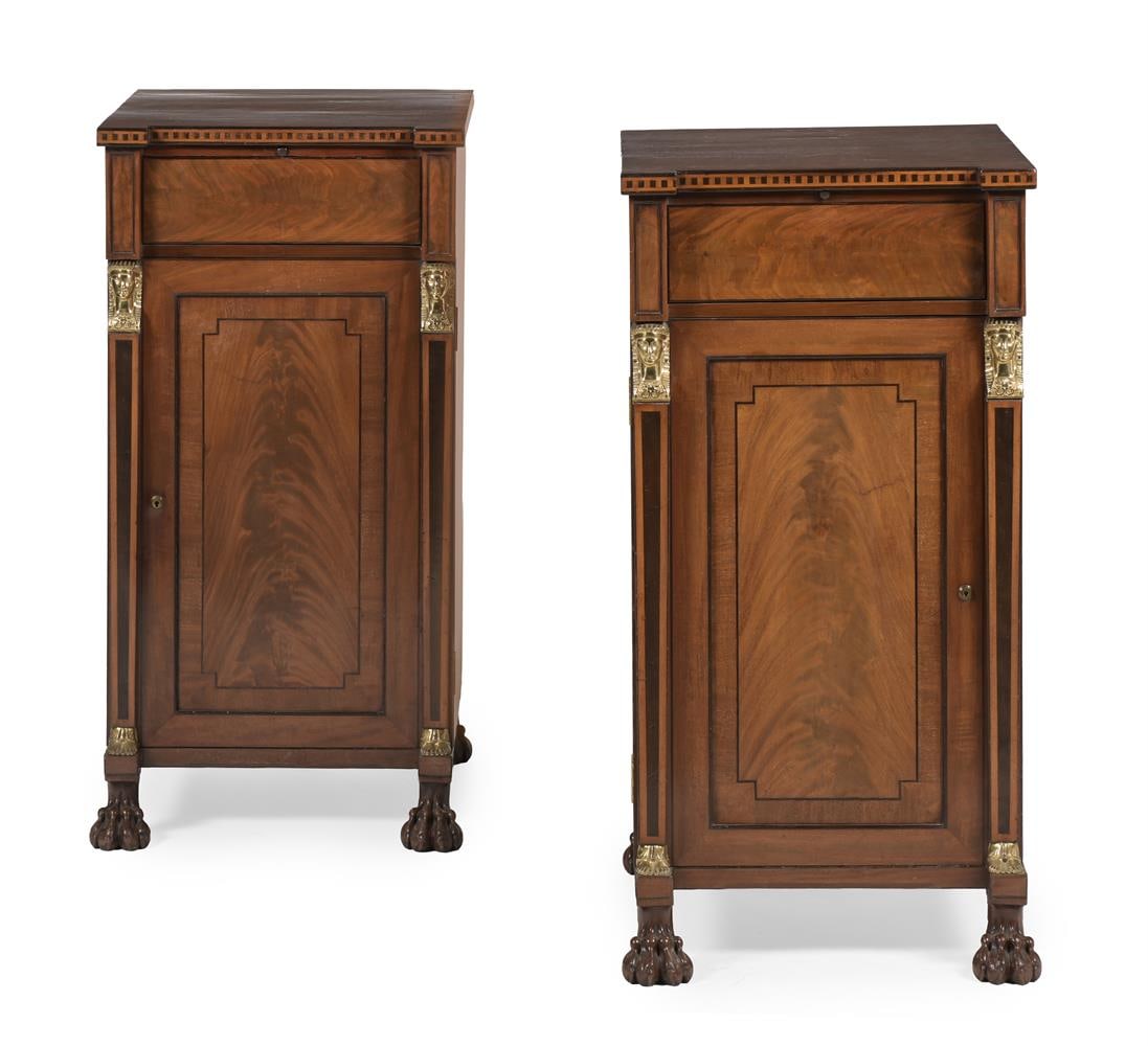 Y A PAIR OF FIGURED MAHOGANY, EBONY AND CHEQUER BANDED CUPBOARDS, CIRCA 1815 AND LATER: Y A PAIR OF FIGURED MAHOGANY, EBONY INLAID AND CHEQUER BANDED PEDESTAL CUPBOARDS IN EGYPTIAN REVIVAL STYLE, CIRCA 1815 AND LATER With blind frieze drawers each 104.5cm high, 54cm wide, 63cm deep
