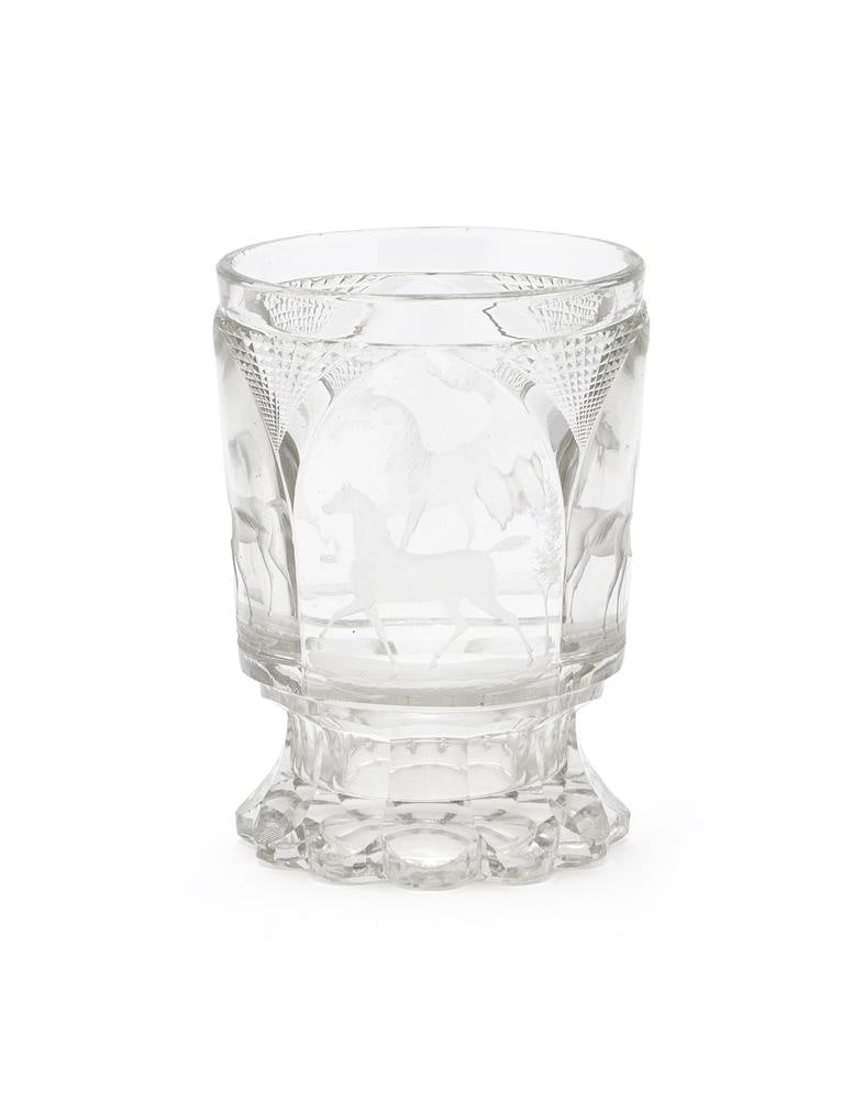 A BOHEMIAN CLEAR AND CUT-GLASS BEAKER OF EQUESTRIAN INTEREST, CIRCA 1860: A BOHEMIAN CLEAR AND CUT-GLASS BEAKER OF EQUESTRIAN INTEREST CIRCA 1860 Cut with lancet panels and each engraved with a horse in a variety of attitudes, petal cut base 12cm high Condition Report: