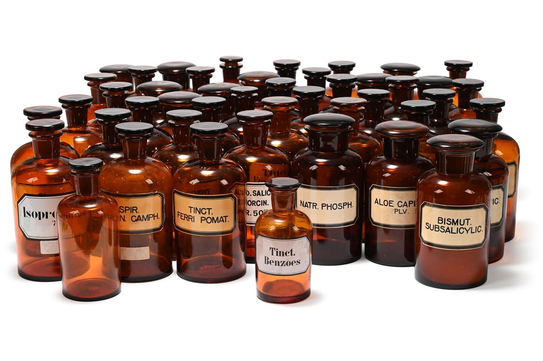A GROUP OF FORTY FIVE FRENCH BROWN GLASS APOTHECARY BOTTLES, LAST QUARTER 19TH CENTURY AND LATER: A GROUP OF FORTY FIVE FRENCH BROWN GLASS APOTHECARY BOTTLES LAST QUARTER 19TH CENTURY AND LATER Some bearing labels of contents in Latin and fitted ground glass stoppers the tallest 23cm high