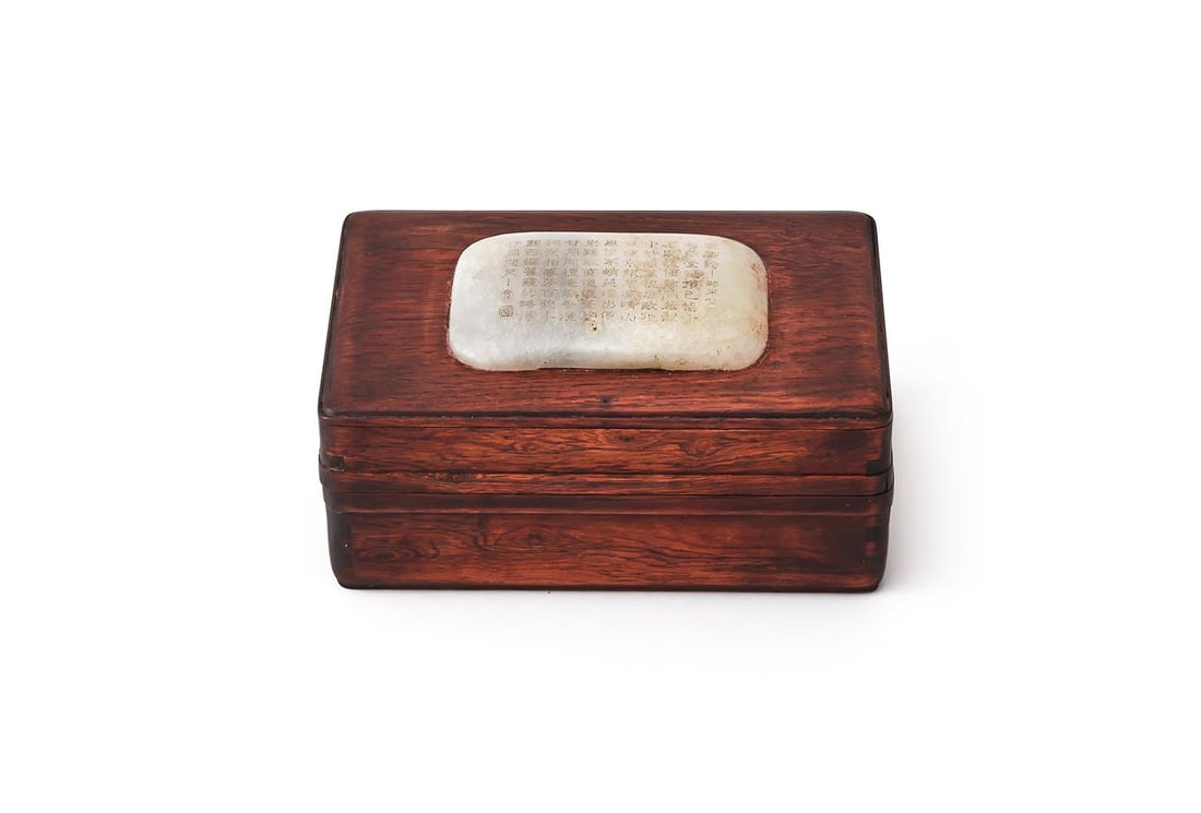 A CHINESE HARDWOOD BOX AND COVER WITH JADE INLAID PLAQUE: A CHINESE HARDWOOD BOX AND COVER WITH JADE INLAID PLAQUE Of rectangular shape The white jade plaque carved with poem in Qianlong style the box 17.5cm long x 12cm wide