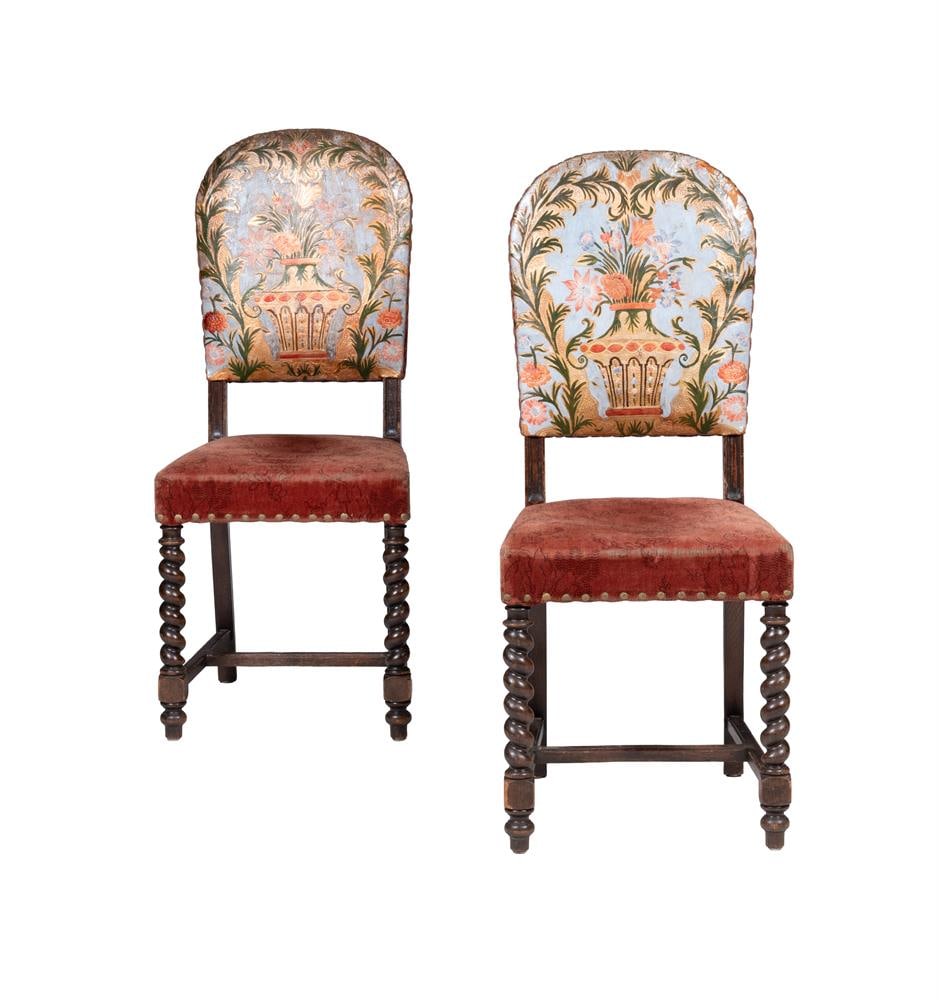 A PAIR OF OAK AND UPHOLSTERED SIDE CHAIRS, LAST QUARTER 19TH CENTURY: A PAIR OF OAK AND UPHOLSTERED SIDE CHAIRS LAST QUARTER 19TH CENTURY The arched back with 'Portuguese Worked' and painted leather backs 108cm high, 46cm wide, 48cm deep Condition Report: