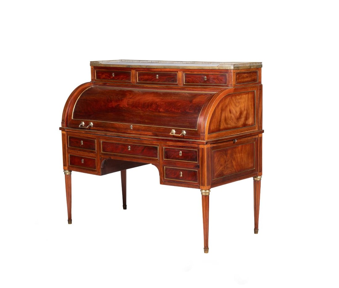 A LOUIS XVI MAHOGANY AND BRASS MOUNTED CYLINDER BUREAU, CIRCA 1780: A LOUIS XVI MAHOGANY AND BRASS MOUNTED CYLINDER BUREAU CIRCA 1780 The cylinder front revealing a fitted interior and with a slide to each side 116cm high, 129cm wide, 65cm deep Condition Report: