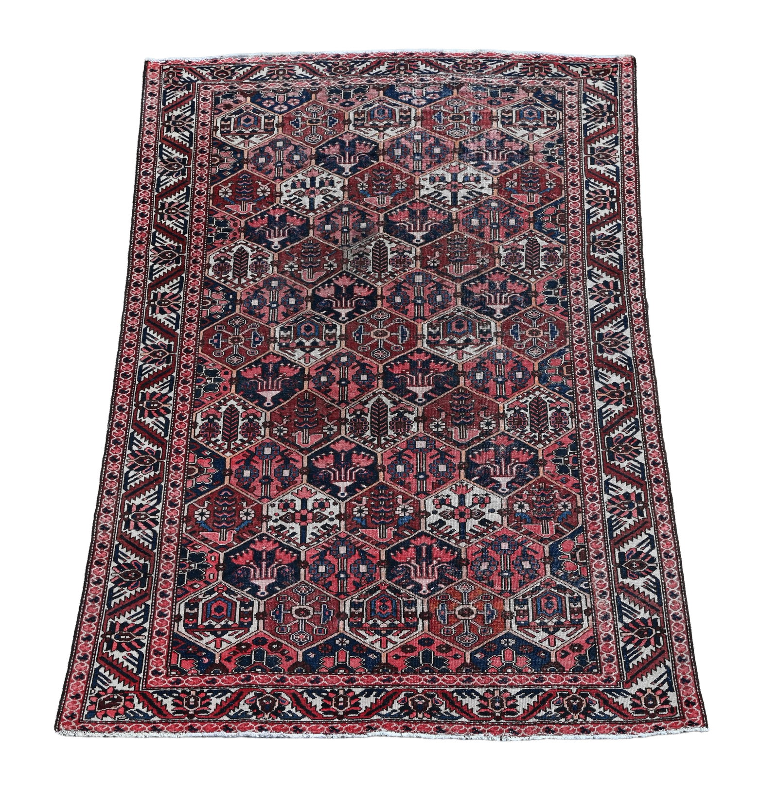 A BAKHTIAR CARPET, IN JOSHAGAN STYLE: A BAKHTIAR CARPET IN JOSHAGAN STYLE approximately 299 x 208cm Condition Report: Generally good but worn quite low, no apparent holes but some fraying of the ends Very decorative with faded /muted