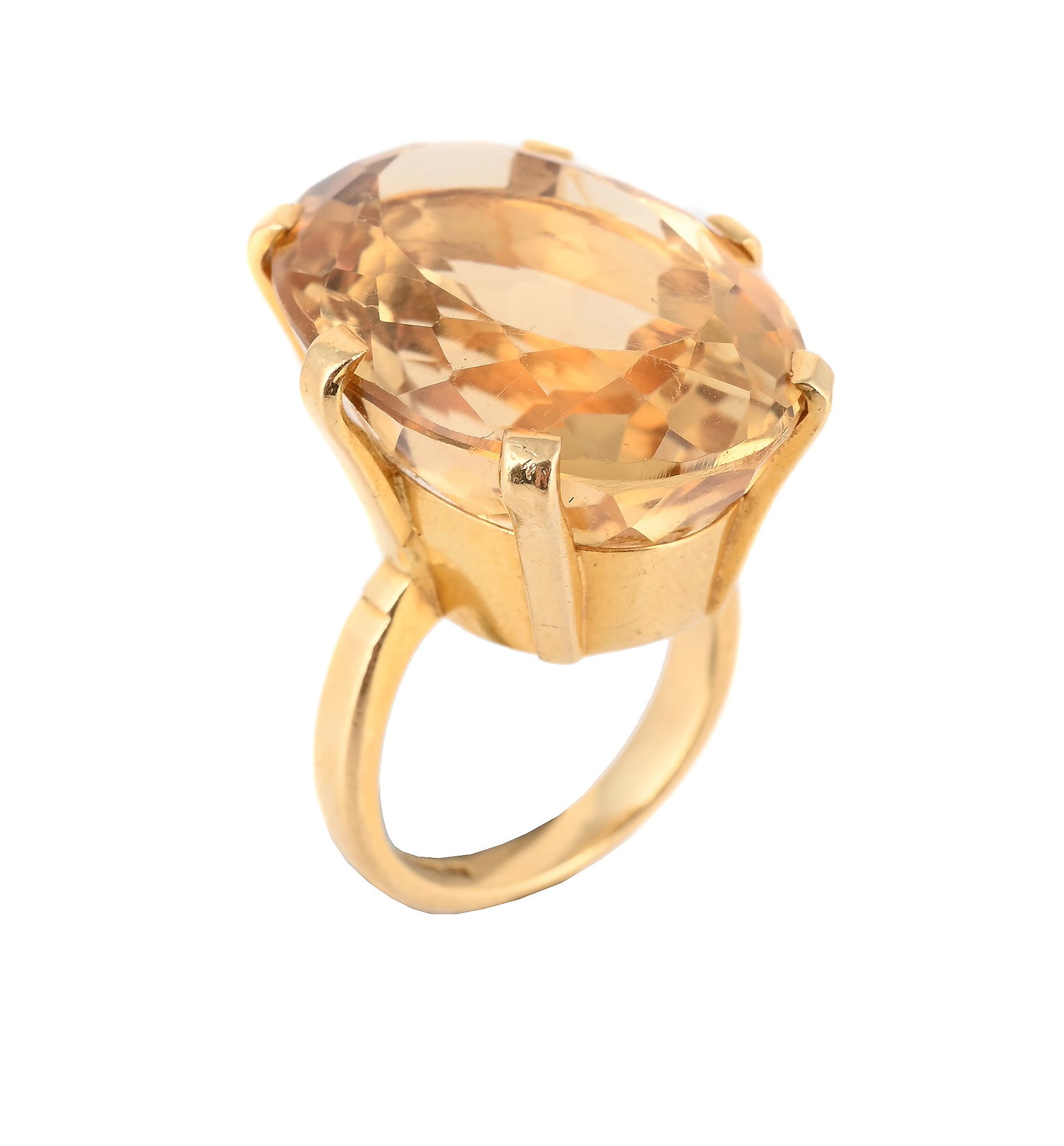 A CITRINE AND 18 CARAT GOLD DRESS RING, DUBLIN 1979: A CITRINE AND 18 CARAT GOLD DRESS RING DUBLIN 1979 The oval cut citrine within a six claw setting, to a polished shank, full hallmark Size/dimensions: ring size M ½ Gross weight: 16.8