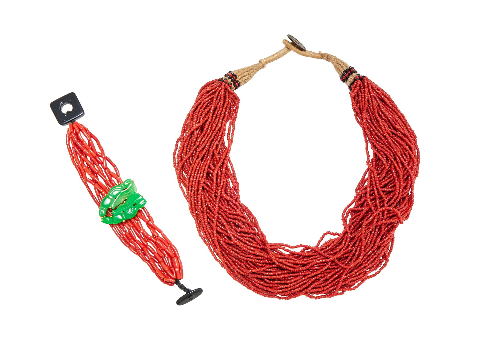 Y A JADEITE JADE AND CORAL BRACELET AND A TORSADE: Y A JADEITE JADE AND CORAL BRACELET AND A TORSADE The bracelet with two j