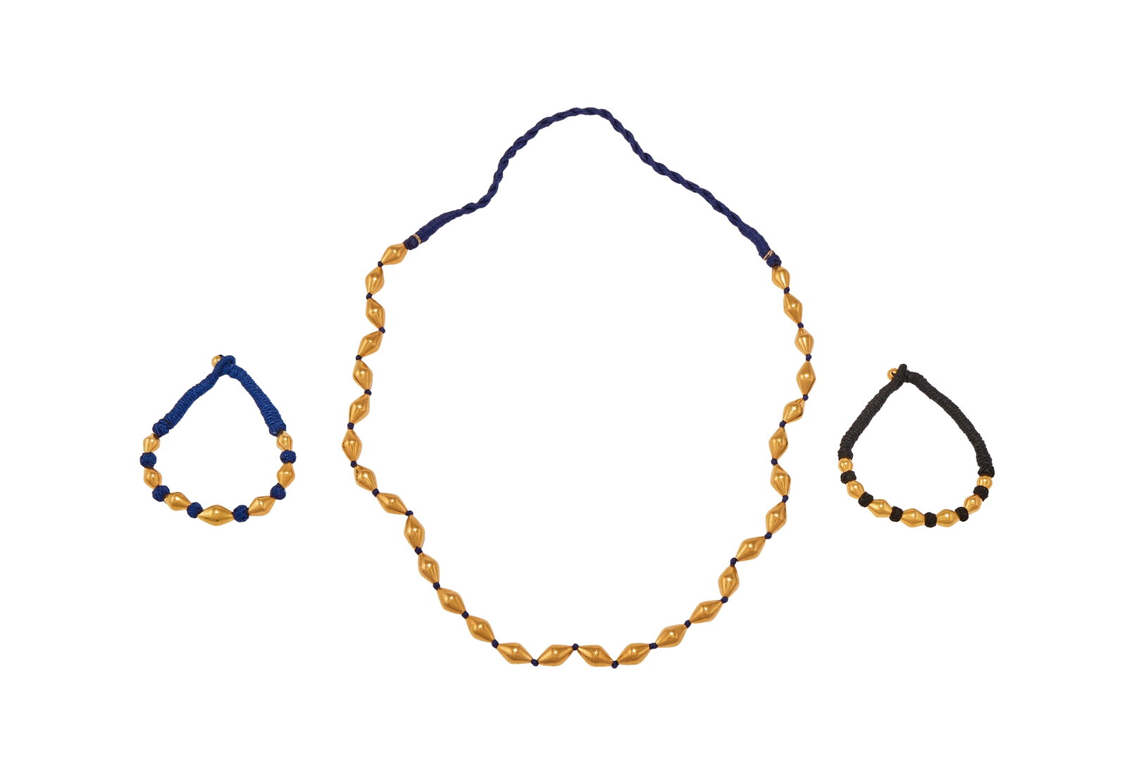 A POLISHED BEAD NECKLACE AND TWO BRACELETS (1 of 1)