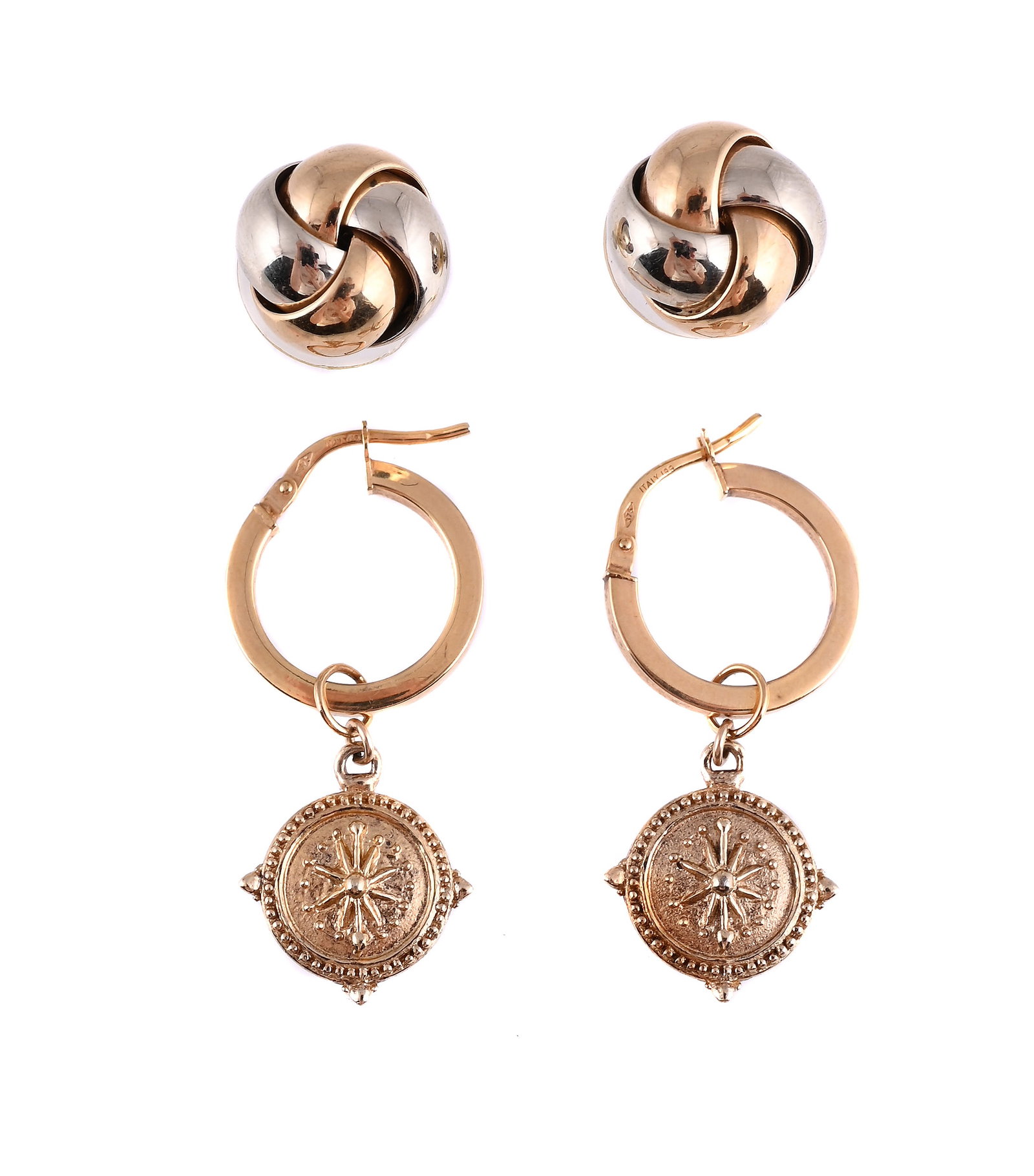 TWO PAIRS OF EARRINGS: TWO PAIRS OF EARRINGS The first polished two colour 9ct gold knot earrings, European convention mark, in an Annabel Jones case; the second with hoop pediments, stamped 375 Made in Italy, to