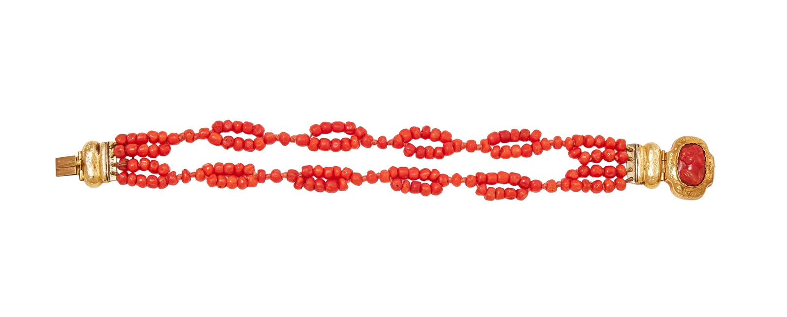 Y A LATE 19TH CENTURY CORAL BRACELET: Y A LATE 19TH CENTURY CORAL BRACELET The lobed articulated clasp with engraved decoration containing a coral cameo carved with the profile of a lady, to a knotted coral bead bracelet,
