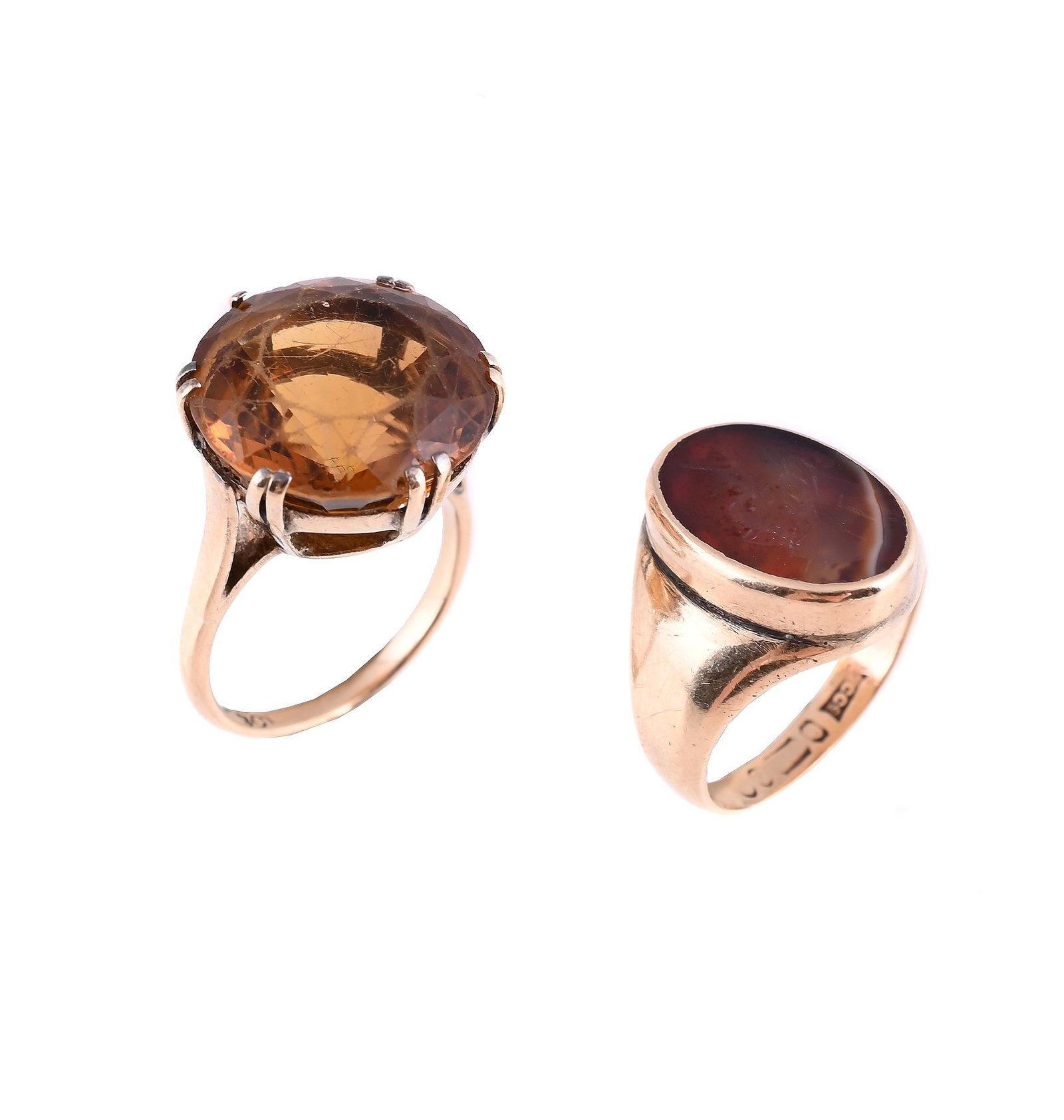 TWO DRESS RINGS: TWO DRESS RINGS The first with an oval hardstone intaglio, carved with a male profile, rubbed 9ct gold hallmark; and a smoky quartz dress ring, stamped 9ct Size/dimensions: first ring size