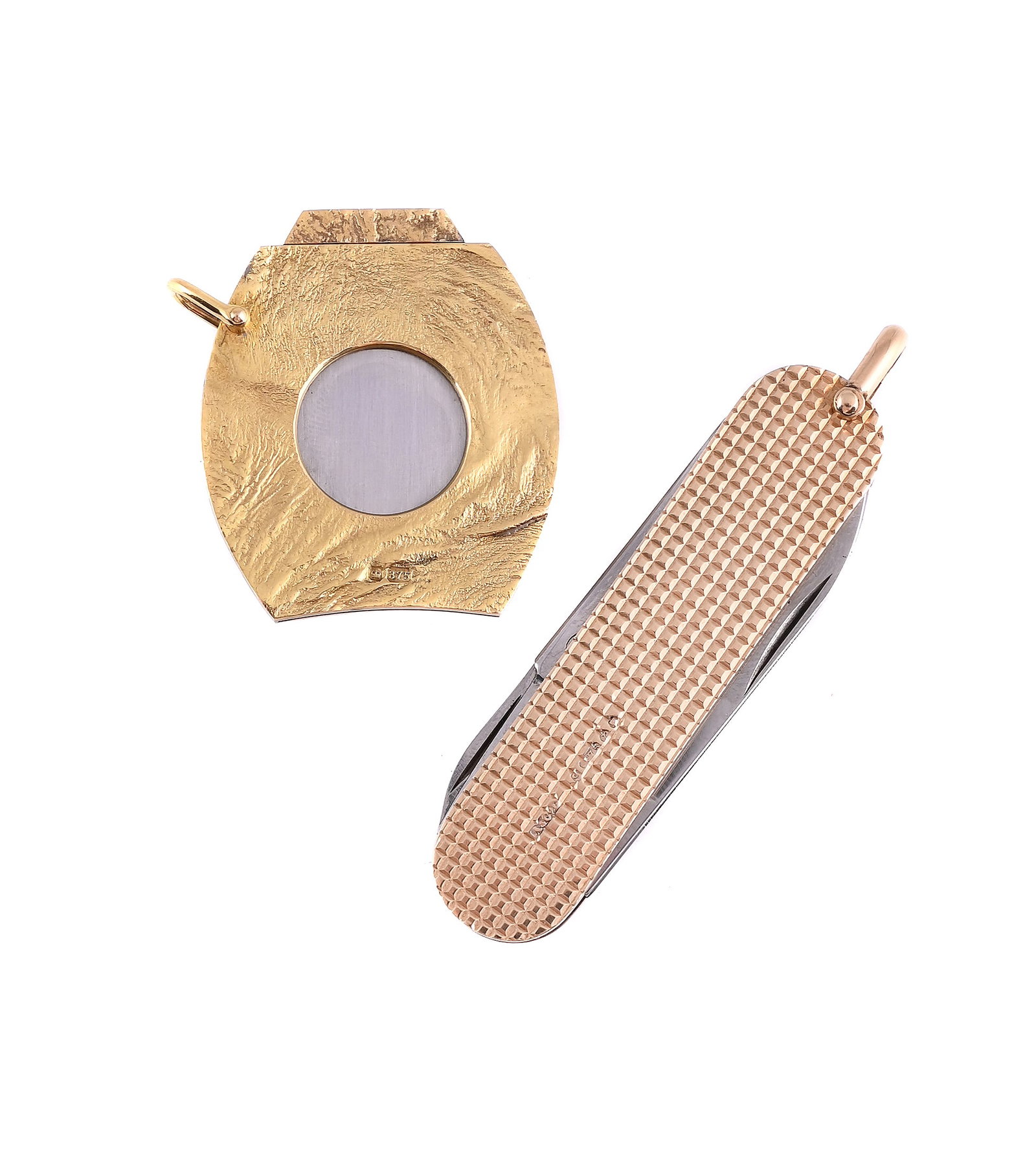 ASPREY, A 9CT GOLD PENKNIFE AND RAMSDEN & ROED, A 9CT GOLD CIGAR CUTTER: ASPREY, A 9CT GOLD PENKNIFE AND RAMSDEN & ROED, A 9CT GOLD CIGAR CUTTER The penknife with polished engine turned decoration, with blade, nail file and scissors, polished suspension loop,