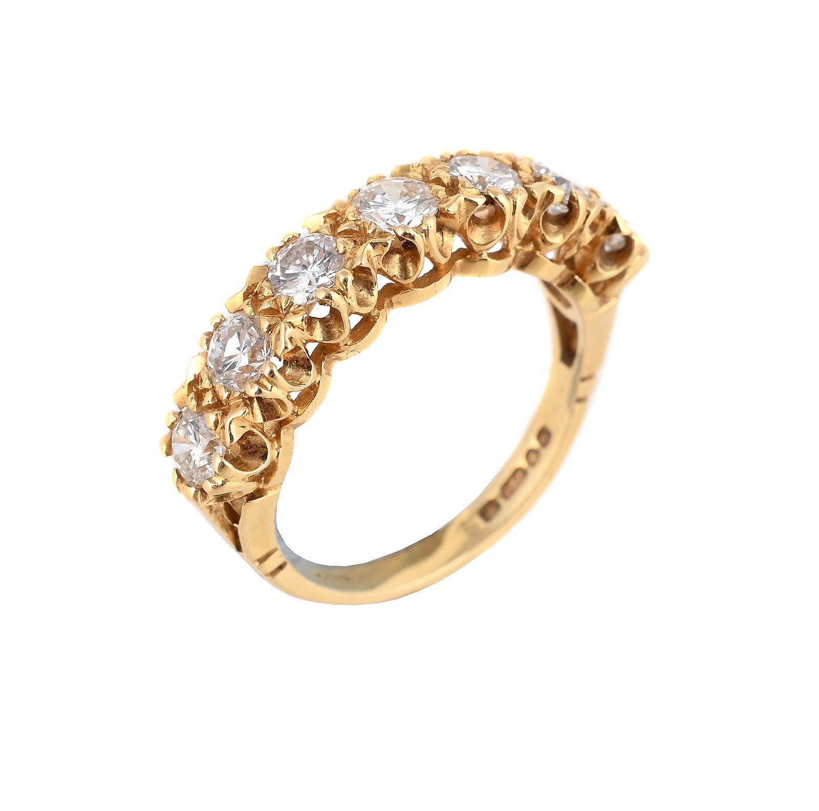 A SEVEN STONE DIAMOND RING, LONDON 1975: A SEVEN STONE DIAMOND RING LONDON 1975 The brilliant cut diamonds in an 18 carat gold setting, full hallmark Size/dimensions: ring size M Gross weight: 4.1 grams Condition Report: