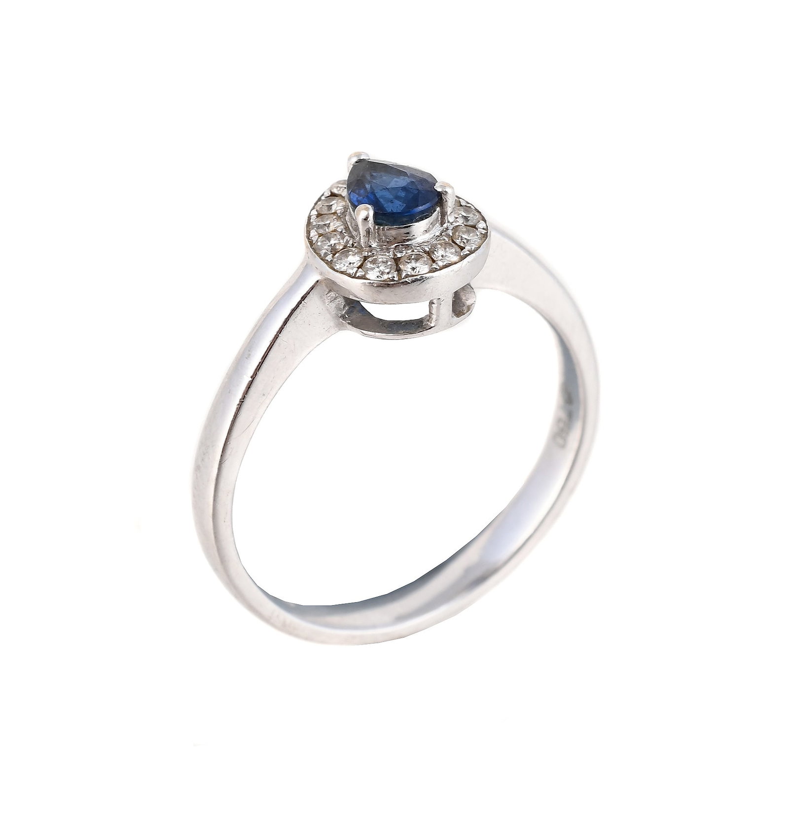 A SAPPHIRE AND DIAMOND CLUSTER RING: A SAPPHIRE AND DIAMOND CLUSTER RING SHEFFIELD 2011 The pear cut sapphire within a brilliant cut diamond surround, the shank stamped S0.40 D0.12, with full 18 carat gold hallmark 