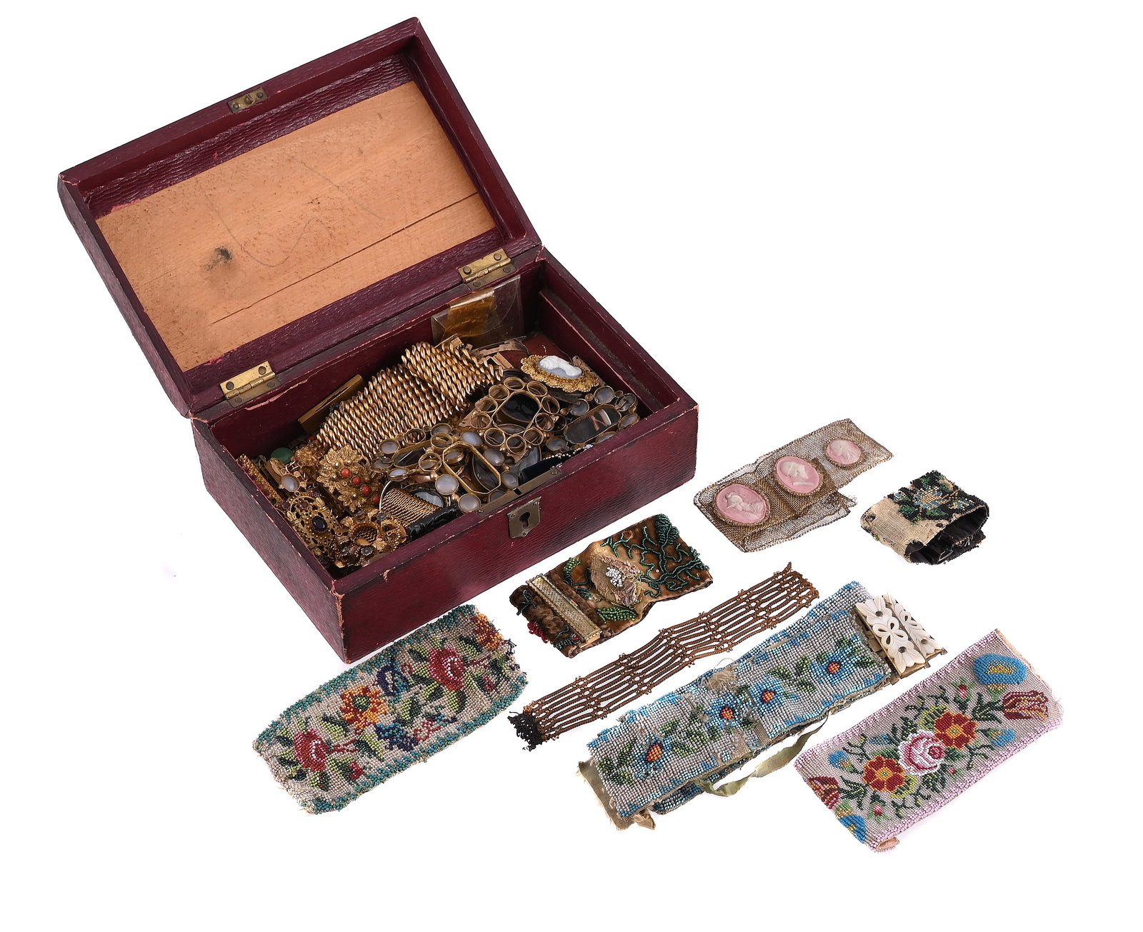 A COLLECTION OF EARLY 19TH CENTURY AND LATER GILT METAL AND PINCHBECK CLASPS AND BRACELETS: A COLLECTION OF EARLY 19TH CENTURY AND LATER GILT METAL AND PINCHBECK CLASPS AND BRACELETS To include various paste set examples; cast floral clasps; a pressed glass cameo clasp; mother-of-pearl set