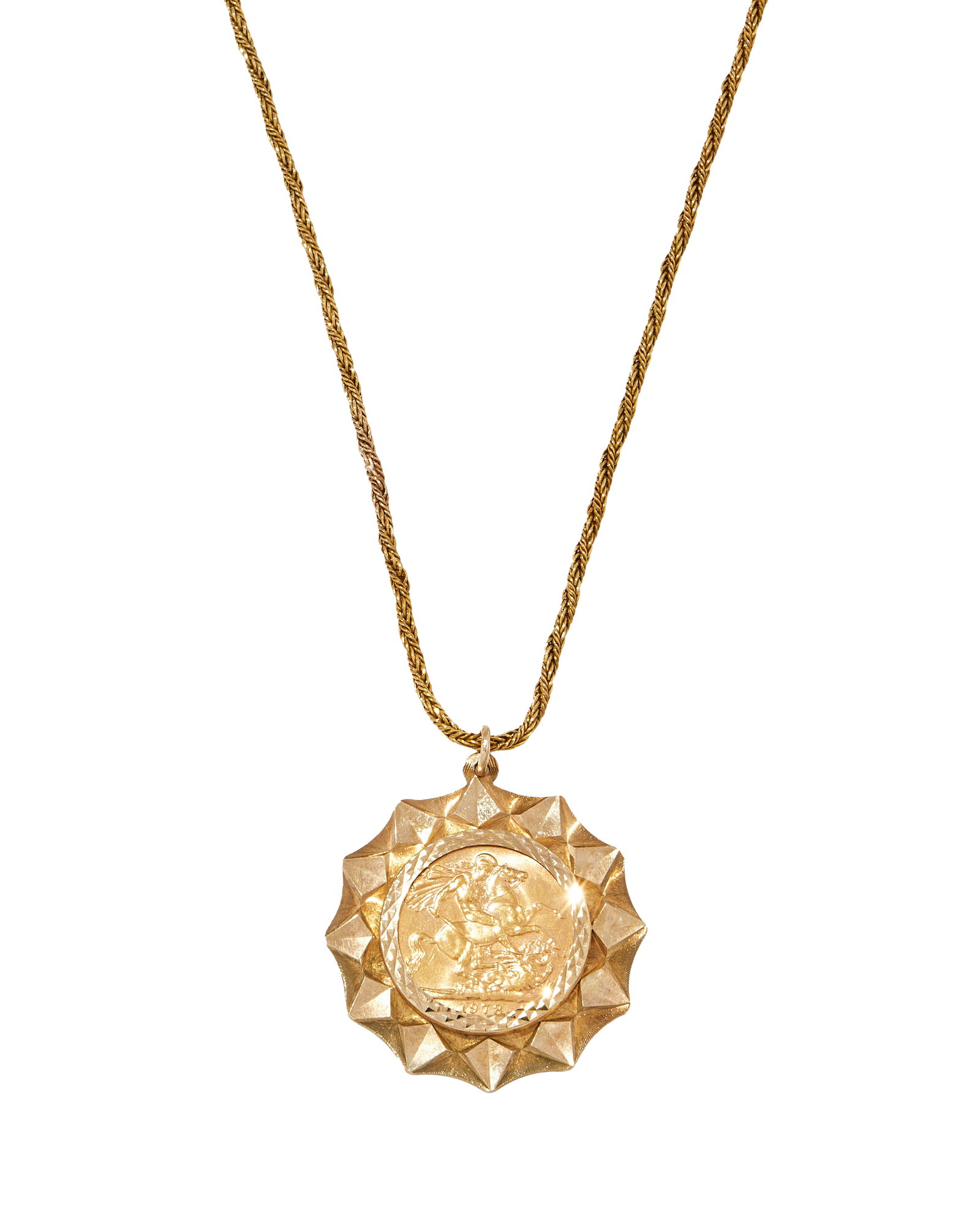 A SOVEREIGN PENDANT NECKLACE: A SOVEREIGN PENDANT NECKLACE The 1978 gold sovereign in a star shaped 9ct gold mount, to a 9ct gold twisted fox link chain, UK hallmarks Size/dimensions: pendant 3.5cm wide, chain 50.5cm long