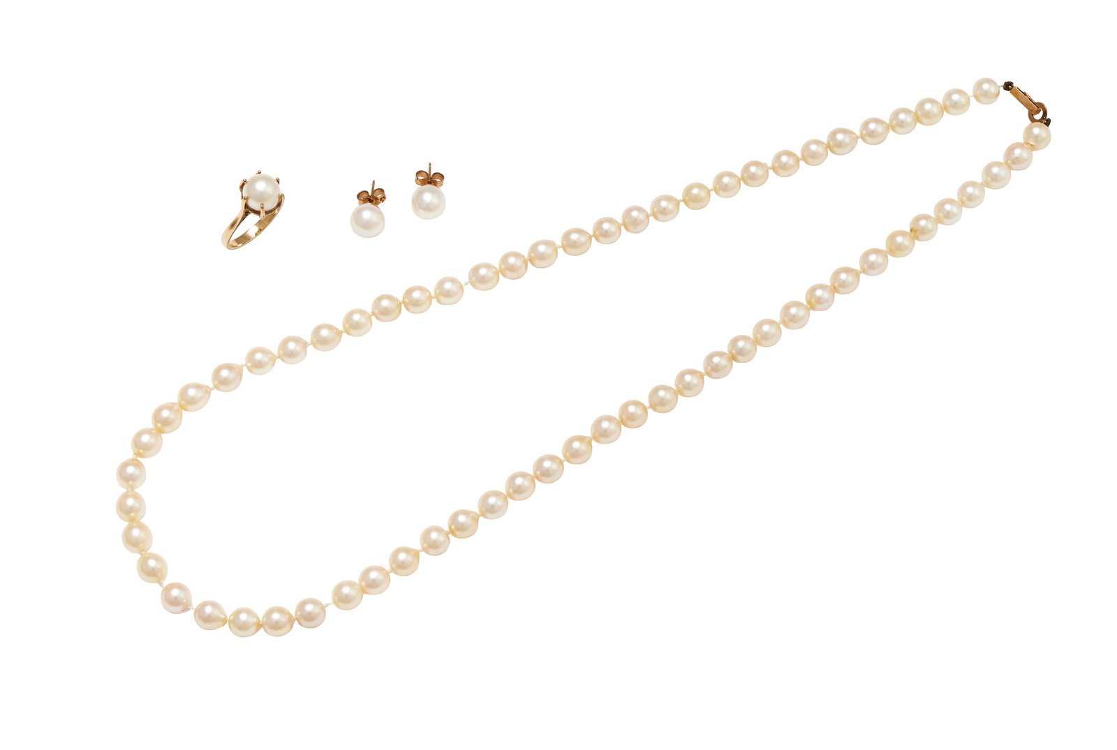A MATCHED GROUP OF CULTURED PEARL JEWELLERY: A MATCHED GROUP OF CULTURED PEARL JEWELLERY To include a cultured pearl single stone ring in claw setting, stamped 9ct; a uniform cultured pearl necklace, to a hoop and clip clasp, unmarked;