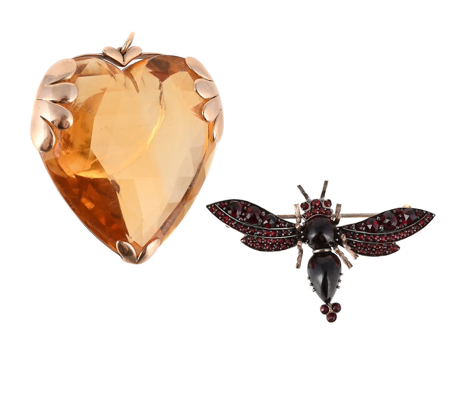 A CITRINE HEART PENDANT AND A GARNET SET BUG BROOCH: A CITRINE HEART PENDANT AND A GARNET SET BUG BROOCH The citrine within a lobed setting, large chip to the reverse, unmarked; together with a gilt metal bohemian garnet set bug brooch, unmarked