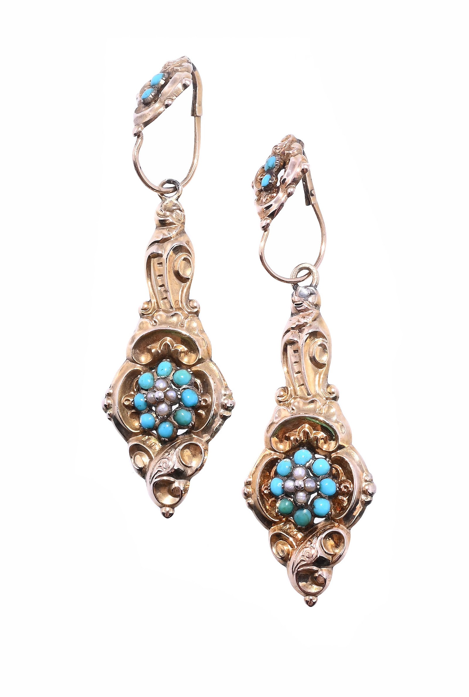 A PAIR OF MID VICTORIAN TURQUOISE AND SEED PEARL EARRINGS: A PAIR OF MID VICTORIAN TURQUOISE AND SEED PEARL EARRINGS CIRCA 1870 The pressed scrolled foliate pediments with cabochon turquoise accents, to removeable drop panels with a seed pearl