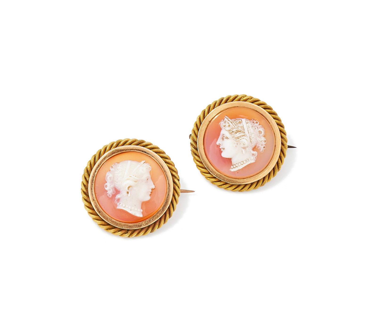 A PAIR OF HARDSTONE CAMEO BROOCHES: A PAIR OF HARDSTONE CAMEO BROOCHES Each carved with a classical female profile within a reeded ropetwist frame, later brooch fittings, unmarked Size/dimensions: 2.3cm wide Gross weight: 14.4 grams
