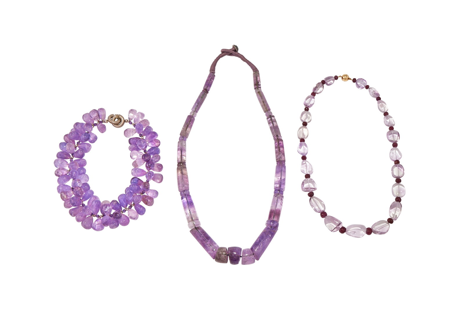 THREE AMETHYST BEAD NECKLACES: THREE AMETHYST BEAD NECKLACES The first with alternating polished pale amethyst beads with facetted rubies between, to a magnetic clasp signed Langer Ag 925; a polished pear shaped amethyst drop