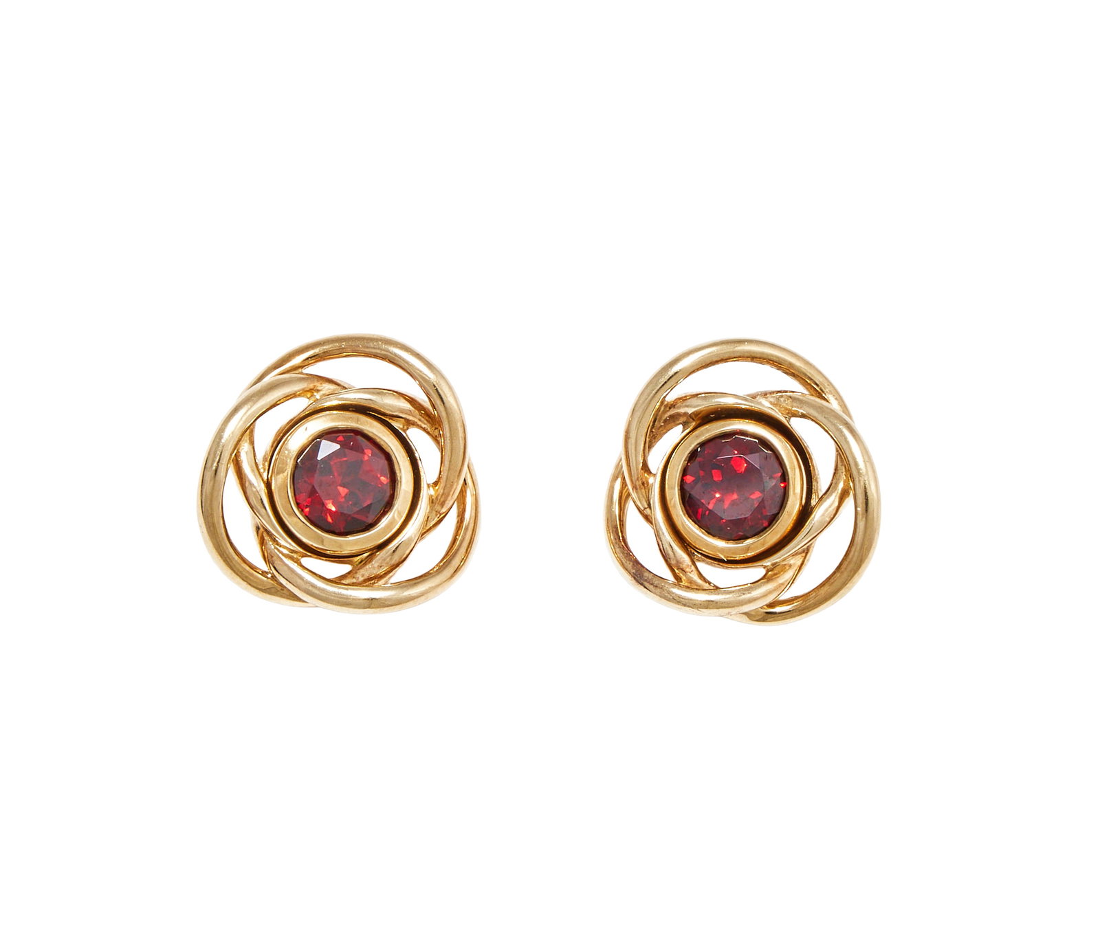 CASSANDRA GOAD, A PAIR OF GARNET EARRINGS: CASSANDRA GOAD, A PAIR OF GARNET EARRINGS Each collet set circular cut garnet 'Theresa' stud, within a removable 'Shippo' halo of 9ct gold wirework design, post fittings, UK