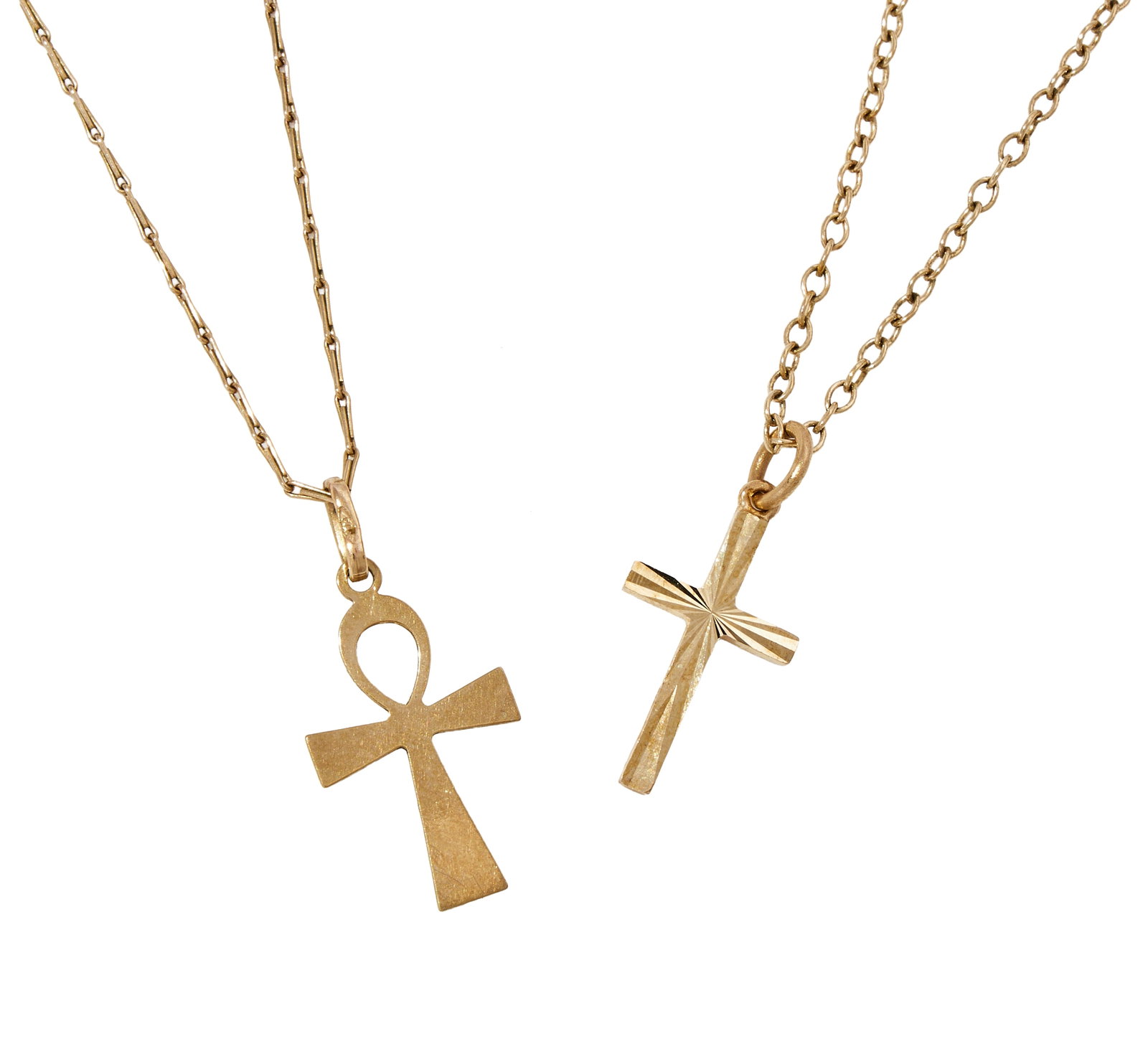 TWO CROSS PENDANTS: TWO CROSS PENDANTS The first a 9ct gold Latin cross of textured and radiant finish, Birmingham 1979 hallmark, on a belcher link chain; the second an Ankh pendant stam