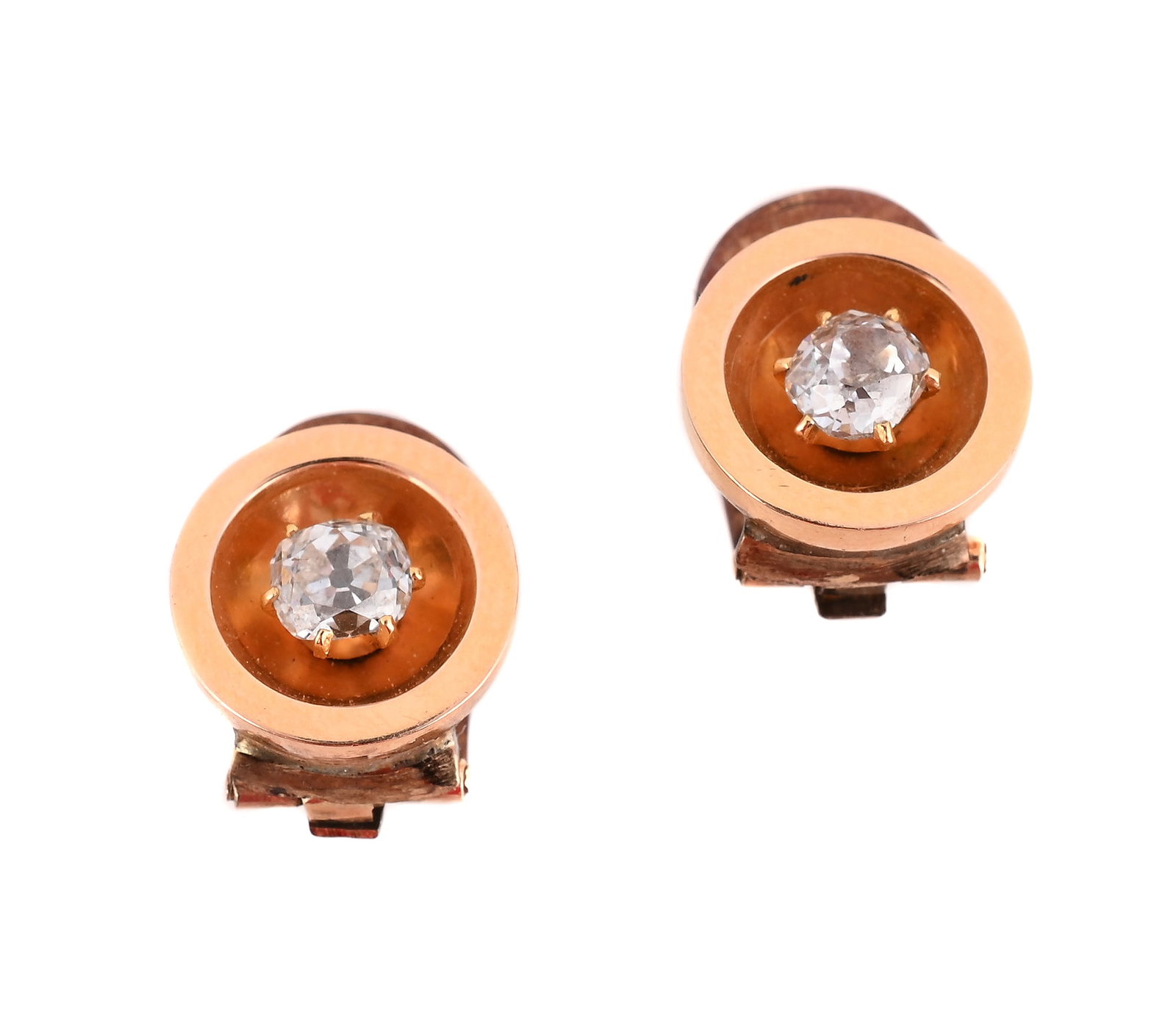 A PAIR OF DIAMOND CLIP EARRINGS: A PAIR OF DIAMOND CLIP EARRINGS The circular panels each with a claw set old mine cut diamond to the centre, clip fittings, unmarked Size/dimensions: 1.1cm d