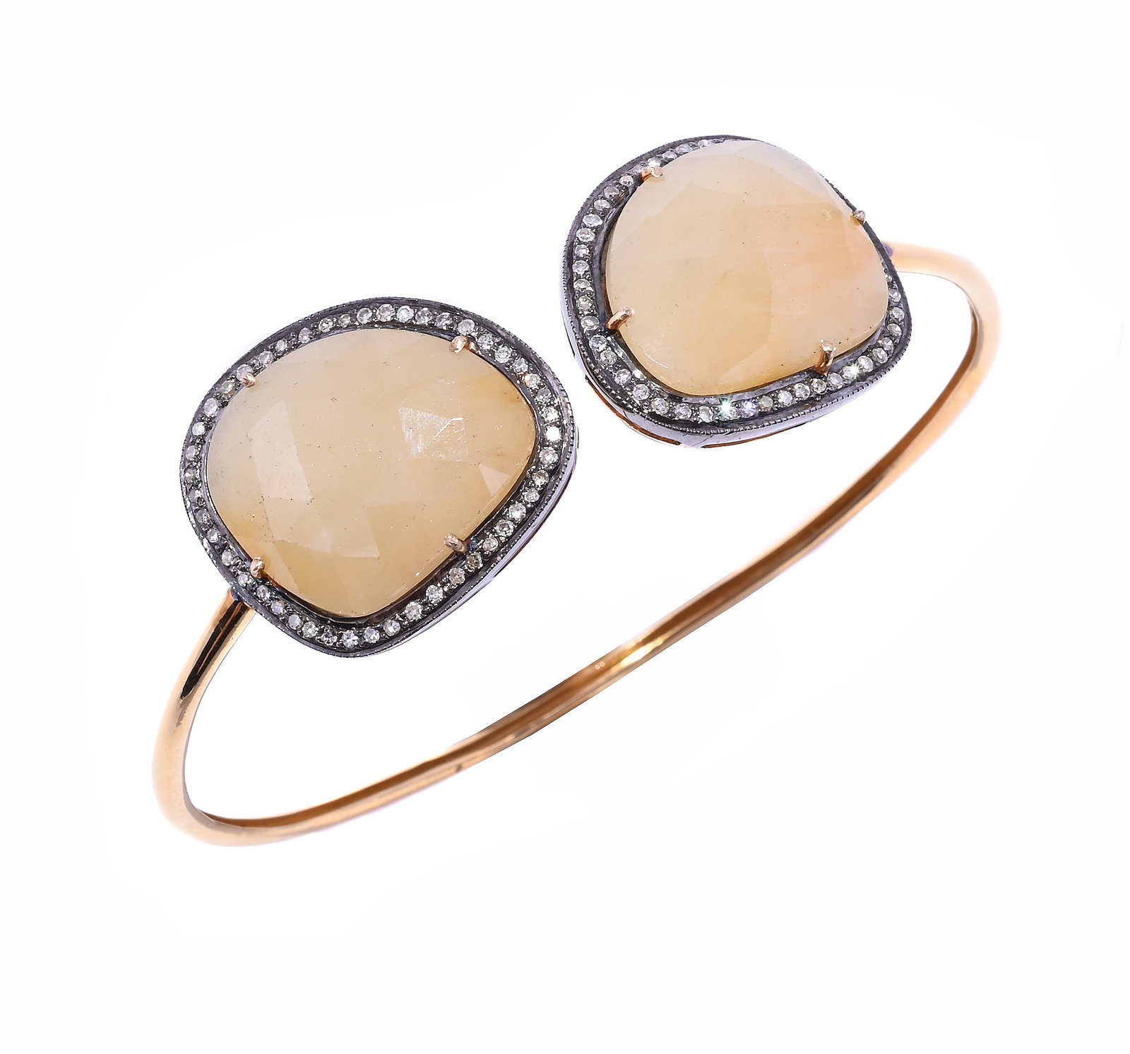 A YELLOW SAPPHIRE AND DIAMOND BANGLE BRACELET: A YELLOW SAPPHIRE AND DIAMOND BANGLE BRACELET The facetted yellow sapphire panels within a surround of single cut diamonds, to a wire back, unmarked Size/dimensions: cluster panels 2.2cm