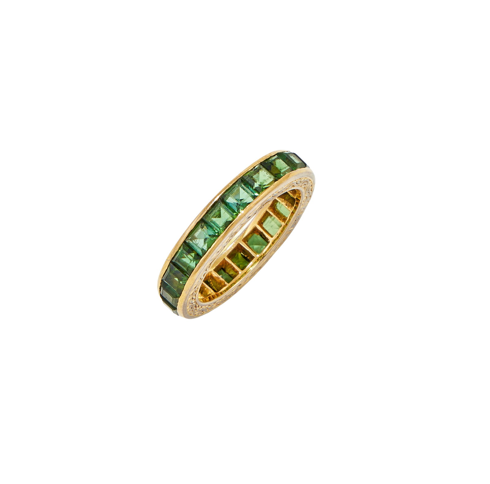 A GREEN TOURMALINE ETERNITY RING: A GREEN TOURMALINE ETERNITY RING Set with a continuous row of square cut green tourmaline, to a foliate gallery, stamped 18ct Size/dimensions: ring size J Gross weight: 5.0 grams Provenance: The