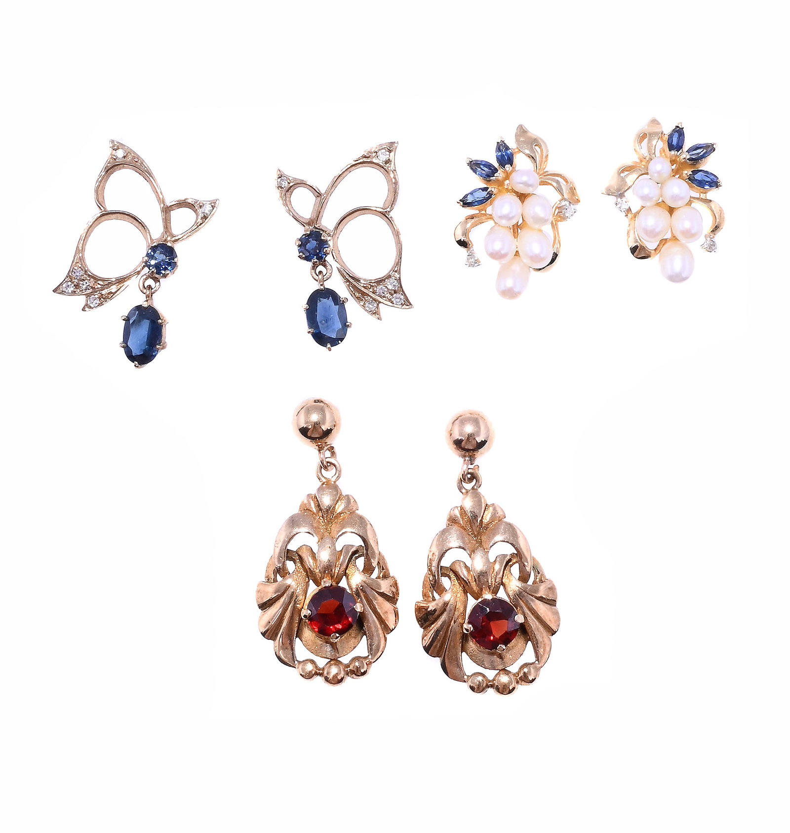 THREE PAIRS OF GEM SET EARRINGS: THREE PAIRS OF GEM SET EARRINGS The first designed as an openwork drop with circular cut garnet centre to a bead surmount, stamped 9ct; the second pair of stylised butterfly design
