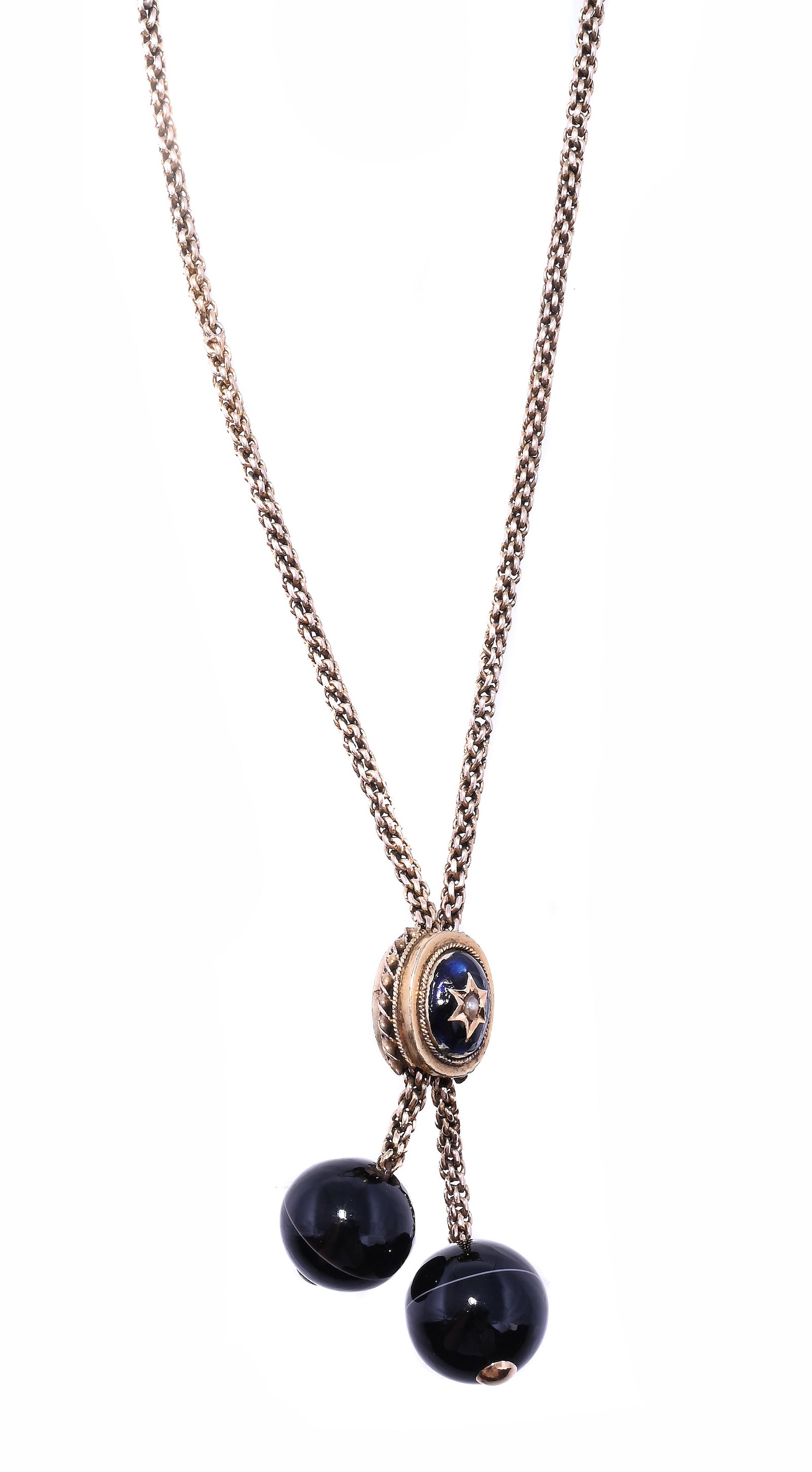A VICTORIAN ENAMEL, SEED PEARL AND BANDED ONYX NECKLACE: A VICTORIAN ENAMEL, SEED PEARL AND BANDED ONYX NECKLACE The linked gold chains with polished onyx bead terminals and enamel and seed pearl set slider with star detail