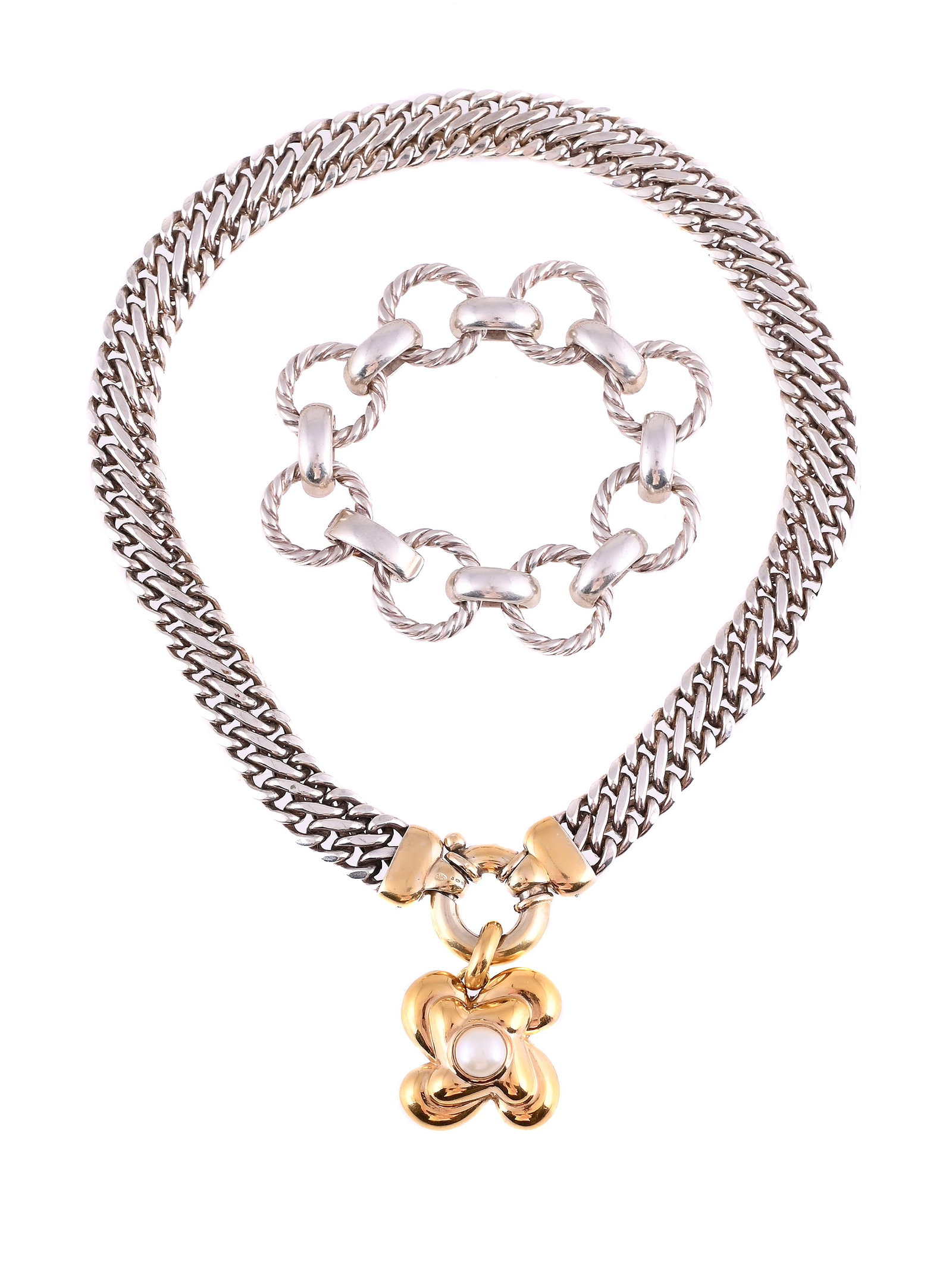 LINKS OF LONDON, A SILVER COLLAR NECKLACE: LINKS OF LONDON, A SILVER COLLAR NECKLACE The flattened double curb link necklace to a polished gilt ring bolt clasp, London import mark 1996, maker's mark; suspending an associated quatrefoil