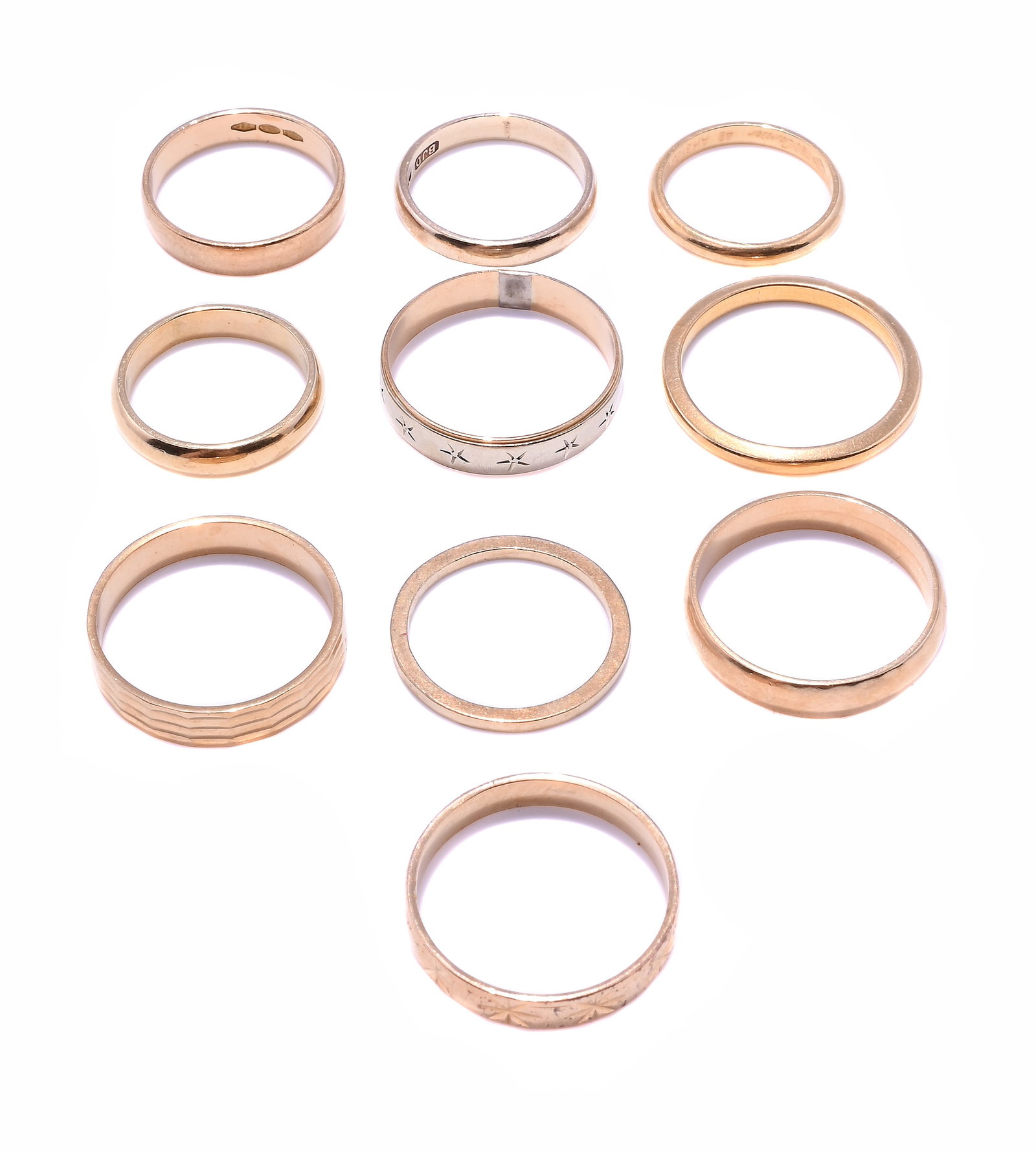 CARTIER, AN 18 CARAT GOLD BAND RING AND A GROUP OF BAND RINGS: CARTIER, AN 18 CARAT GOLD BAND RING AND A GROUP OF BAND RINGS The polished band signed Cartier, European convention mark, 49, numbered AH3166; together with further band rings, including a 22