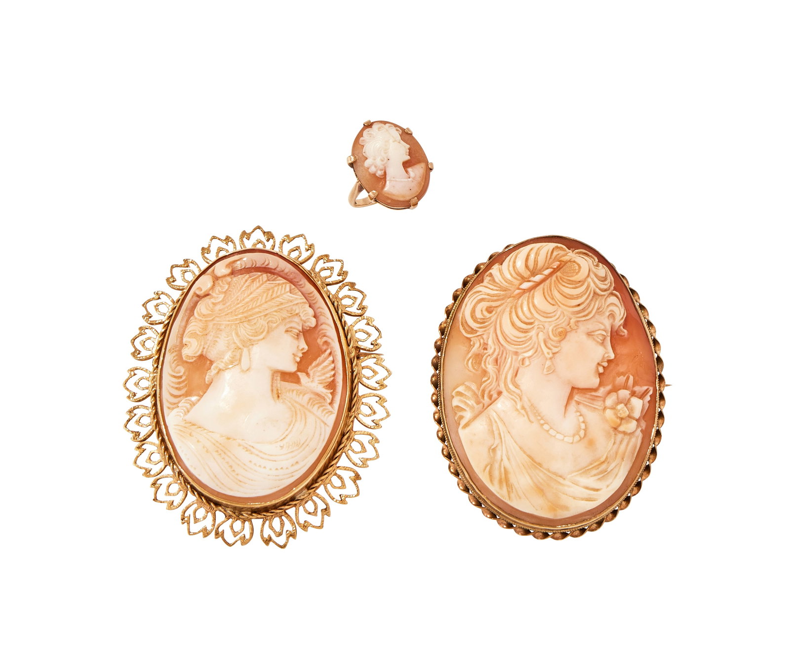 A SMALL GROUP OF SHELL CAMEO JEWELLERY: A SMALL GROUP OF SHELL CAMEO JEWELLERY Comprising a shell cameo carved with the profile of a lady with a dove to her shoulder and feather border, within a 9 carat gold pierced textured