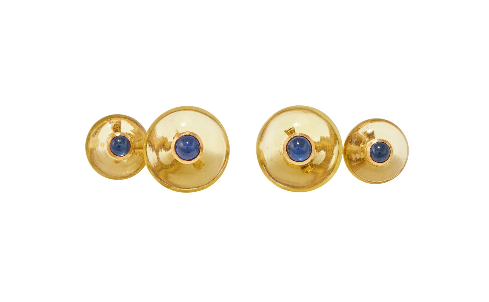 A PAIR OF LEMON QUARTZ AND SAPPHIRE CUFFLINKS: A PAIR OF LEMON QUARTZ AND SAPPHIRE CUFFLINKS The polished lemon quartz panels each centred with a circular cabochon sapphire, to baton link connectors, stamped 18k Size/dimensions: larger 1.3cm