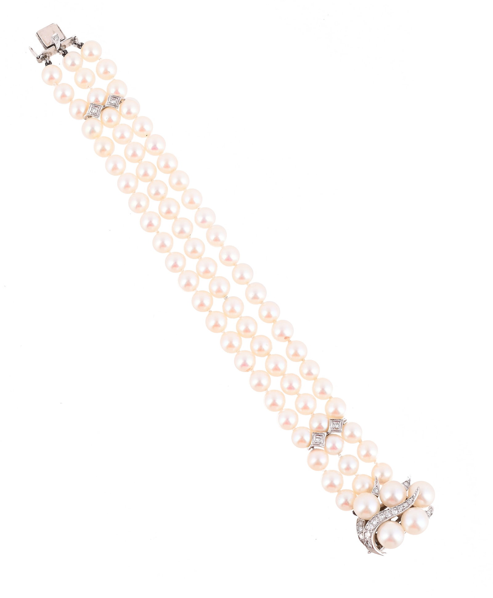 A DIAMOND AND CULTURED PEARL BRACELET: A DIAMOND AND CULTURED PEARL BRACELET The three strands of uniform cultured pearls to single cut diamond set spacers, and an abstract single cut diamond and cultured pearl clasp, unmarked 