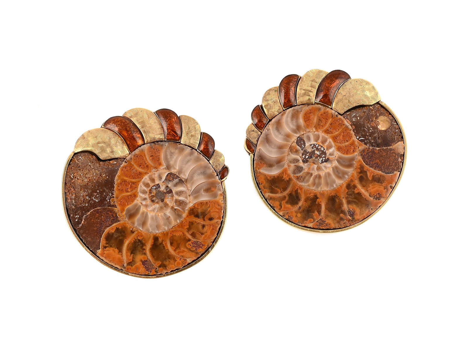 A PAIR OF AMMONITE AND ENAMEL EARRINGS: A PAIR OF AMMONITE AND ENAMEL EARRINGS The polished slices of ammonite with textured and brown enamelled detail, stud fittings, unmarked Size/dimensions: 3cm diameter Gross weight: 29.6