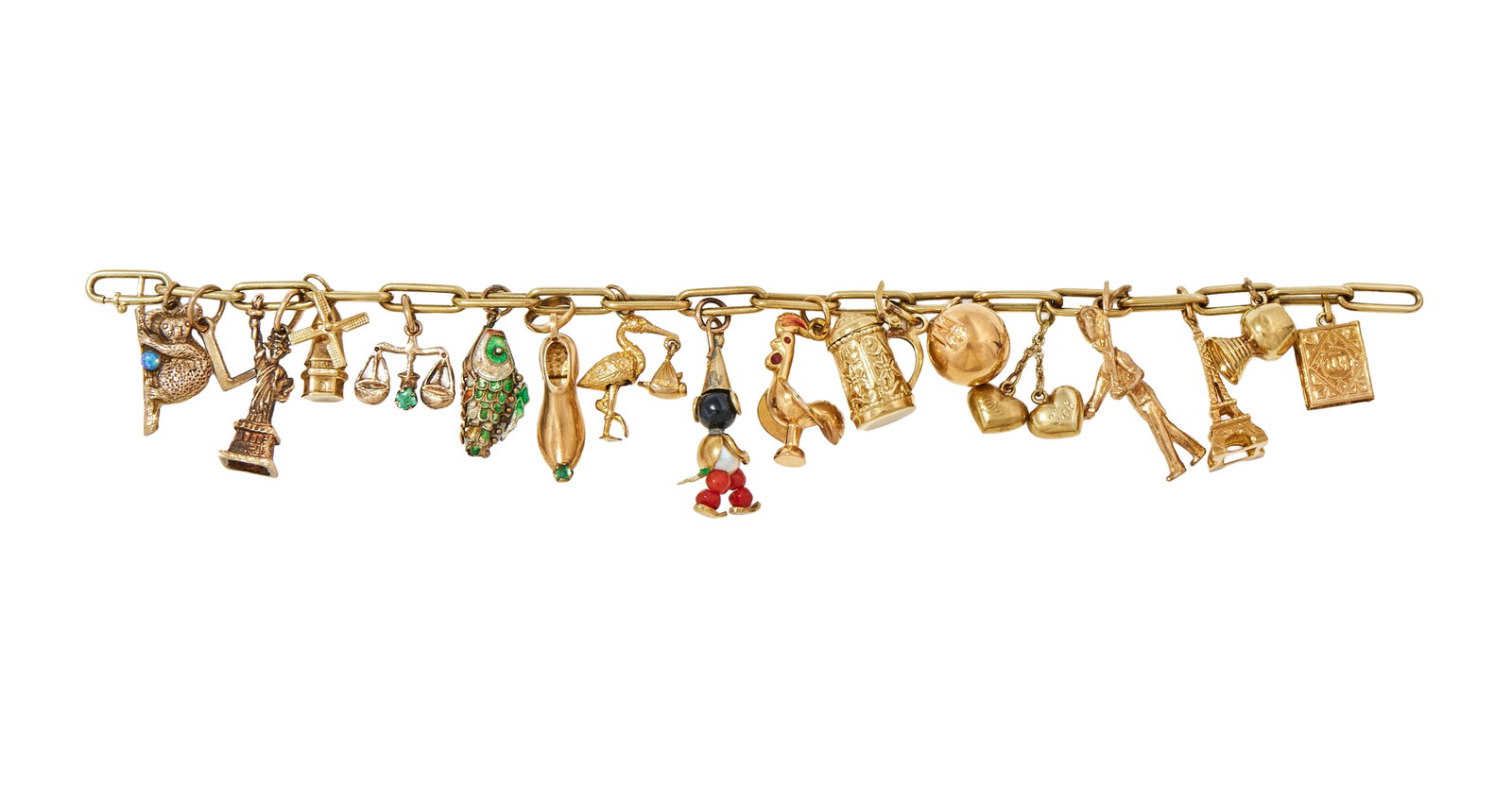 Y A CHARM BRACELET: Y A CHARM BRACELET The belcher link bracelet, with Dutch 585 control mark, suspending various charms including a 9ct gold charm of a soldier wearing a bearskin hat, UK hallmark, an Eiffel Tower