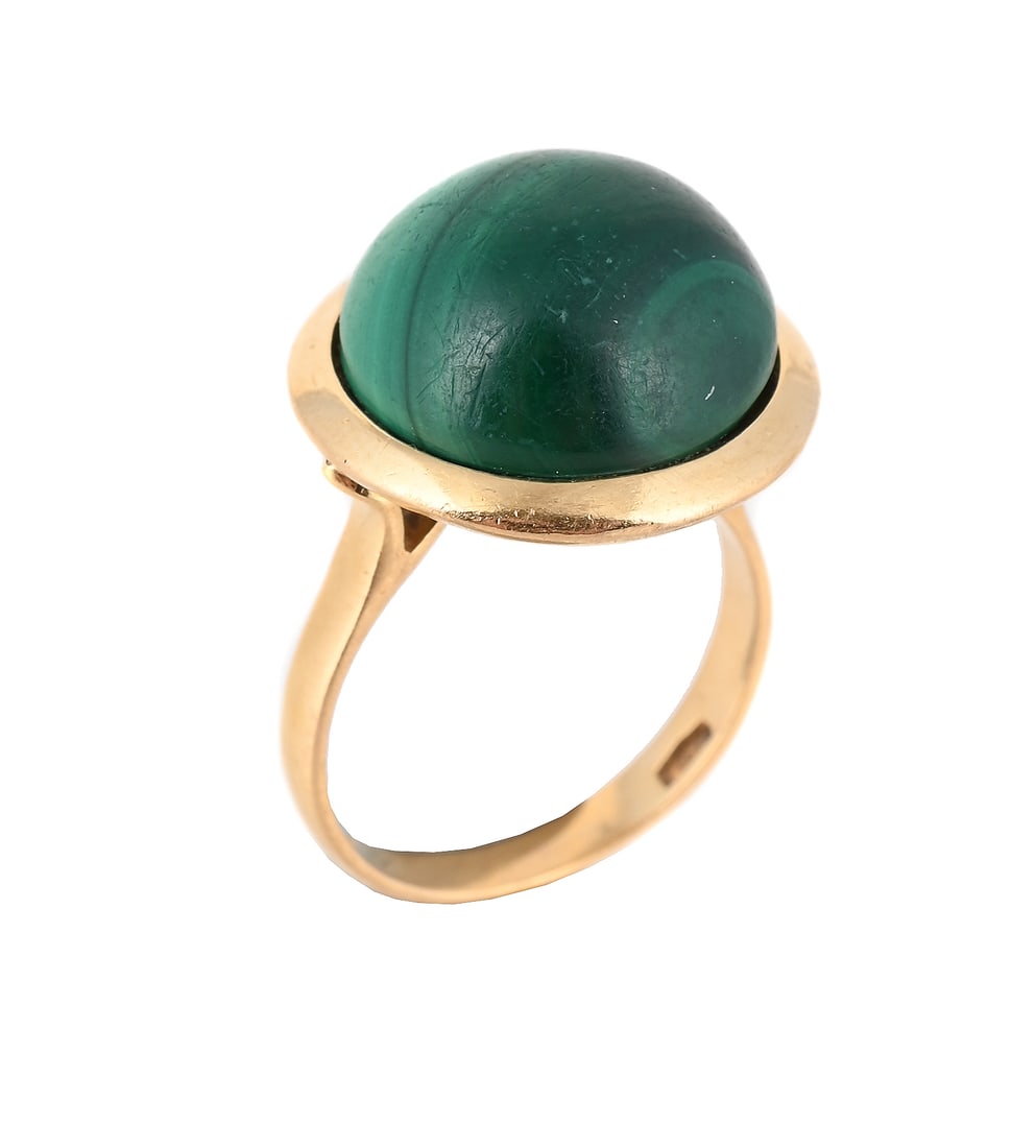 A MALACHITE DRESS RING: A MALACHITE DRESS RING The circular cabochon