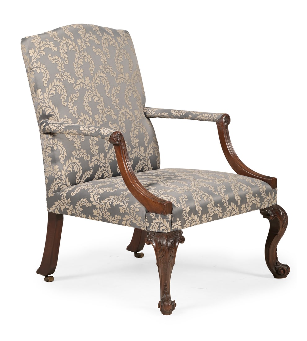 A CARVED MAHOGANY AND UPHOLSTERED GAINSBOROUGH ARMCHAIR, IN GEORGE III STYLE, 19TH CENTURY (1 of 3)