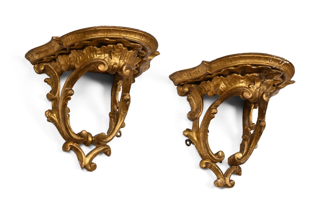 A PAIR OF GEORGE III CARVED GILTWOOD AND GESSO ROCOCO WALL BRACKETS, CIRCA 1770: A PAIR OF GEORGE III CARVED GILTWOOD AND GESSO ROCOCO WALL BRACKETSCIRCA 177025cm high, 26cm wide, 20cm deep
