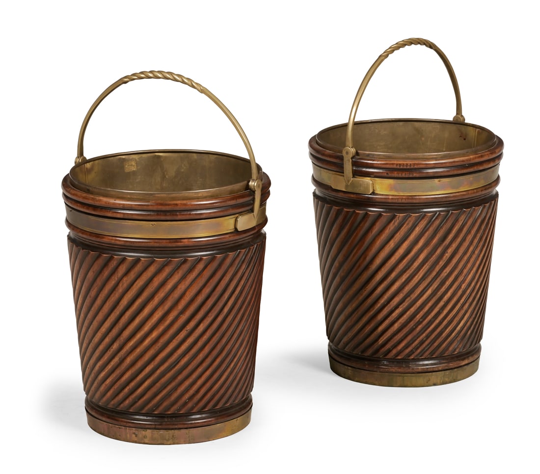 A PAIR OF CARVED MAHOGANY AND BRASS BOUND BUCKETS, IN GEORGE III STYLE, 20TH CENTURY: A PAIR OF CARVED MAHOGANY AND BRASS BOUND BUCKETSIN GEORGE III STYLE, 20TH CENTURYWith removable brass liners44cm high, 35.5cm wide