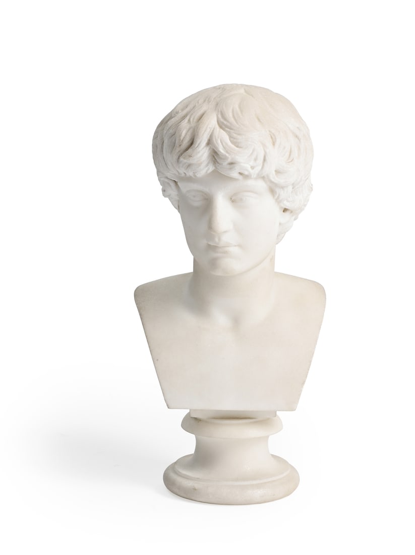 AFTER THE ANTIQUE, A GRAND TOUR MARBLE BUST OF ANTINOUS, ITALIAN, DATED 1860: AFTER THE ANTIQUE, A GRAND TOUR MARBLE BUST OFANTINOUS ITALIAN, DATED 1860 28cm high, the base 9.5cm diameter This well-carved small marble bust is based on portraits of the Roman youthAntinous, Emper