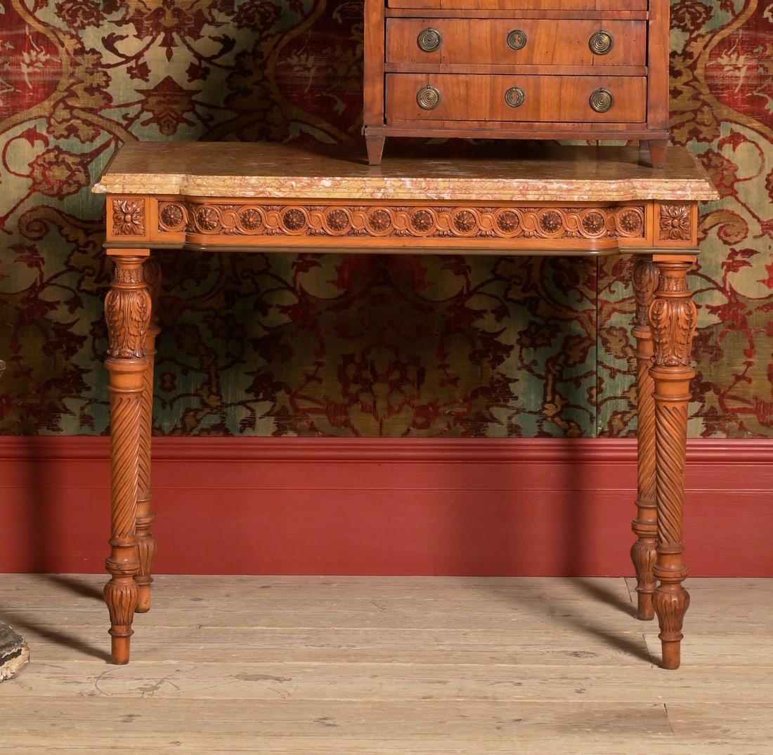 A FINE LOUIS XVI CARVED SATINWOOD AND BRASS MOUNTED SIDE OR CONSOLE TABLE, BY GEORGES JACOB: A FINE LOUIS XVI CARVED SATINWOOD AND BRASS MOUNTED SIDE OR CONSOLE TABLEBY GEORGES JACOB, LATE 18TH CENTURYStamped 'JME G.JACOB' to the underside, with a shaped Brocatello marble top72cm high, 89cm w