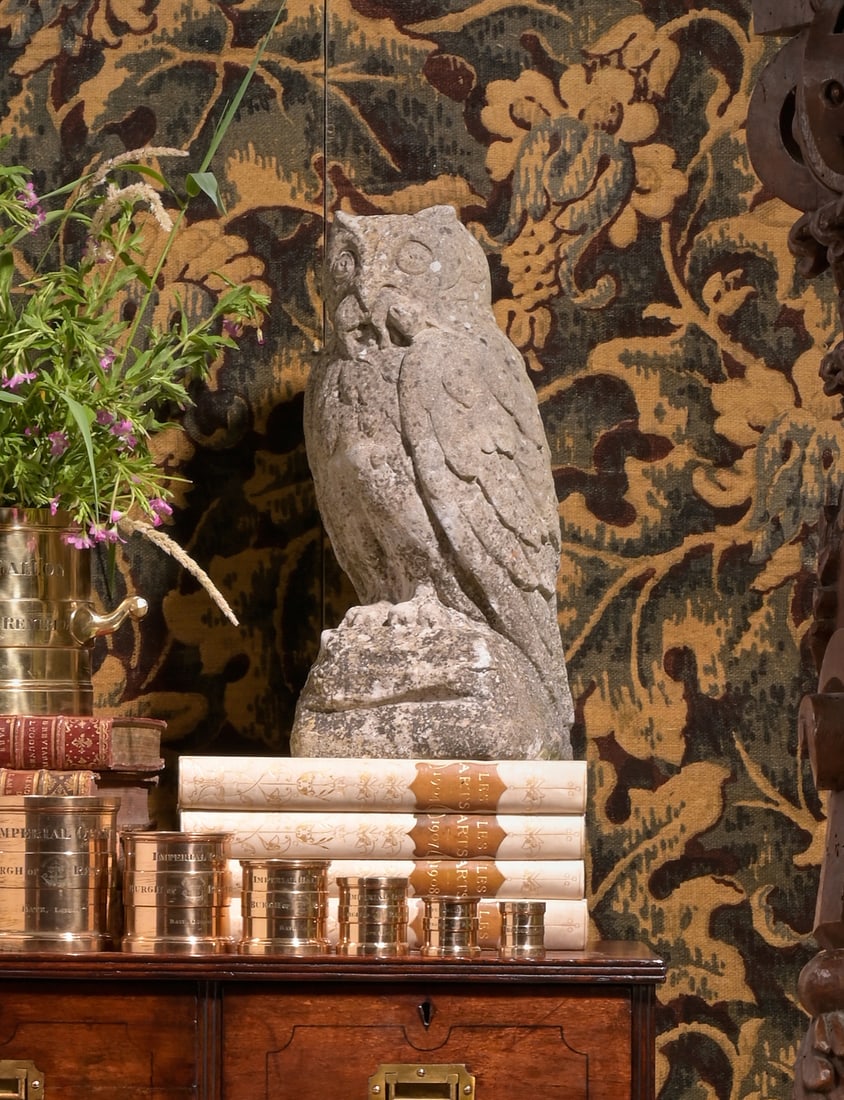 A CARVED PORTLAND STONE MODEL OF AN OWL, LATE 19TH CENTURY: A CARVED PORTLAND STONE MODEL OF AN OWLLATE 19TH CENTURYOn an associated painted plinththe owl 49cm high, the plinth 123cm high, 42cm square172cm high overall