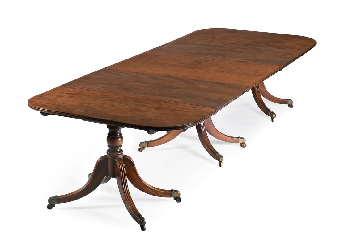 A MAHOGANY TRIPLE PILLAR DINING TABLE, CIRCA 1780 AND LATER (1 of 3)