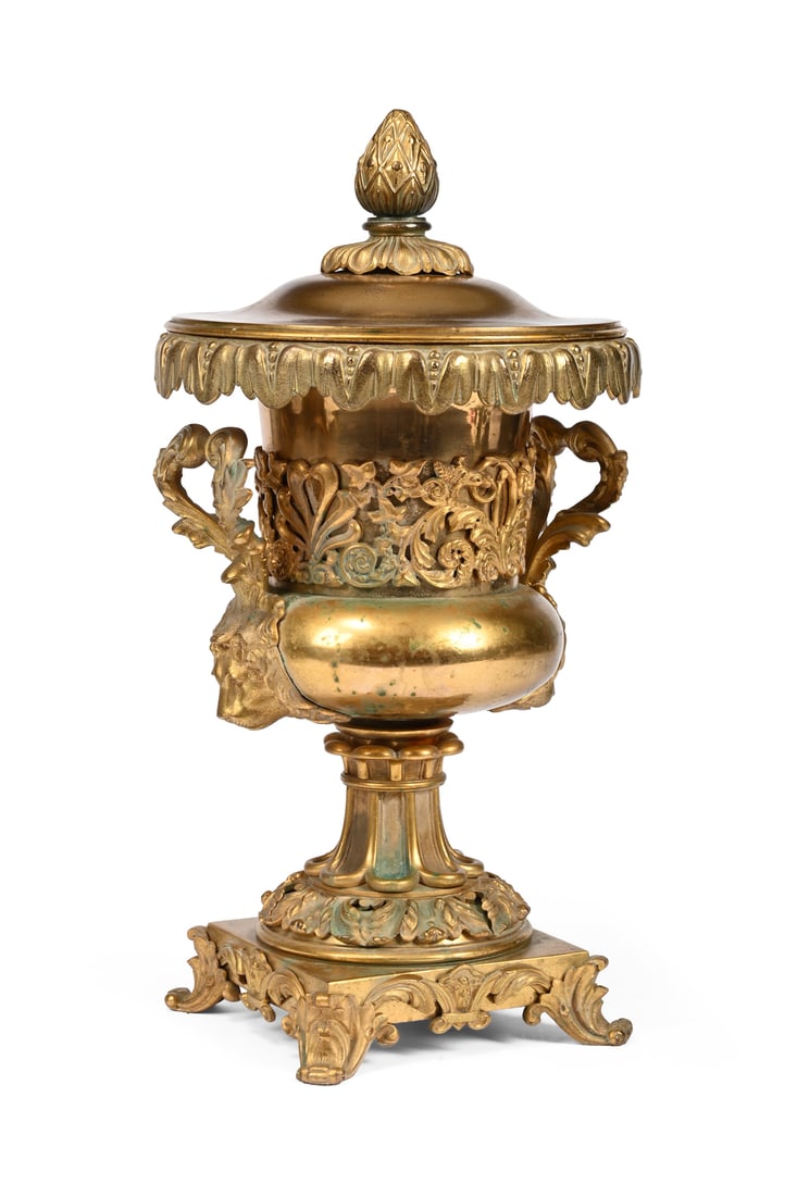 A GILT BRONZE TABLE TOP WINE COOLER, 19TH CENTURY: A GILT BRONZE TABLE TOPWINE COOLER19TH CENTURY Of lidded urn form, with a gilt metal liner 46cm high, the base 19cm wide