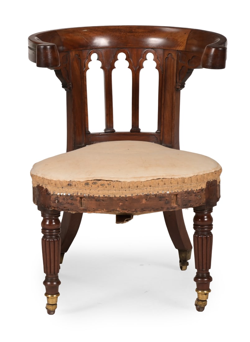 A GEORGE IV MAHOGANY GOTHIC LIBRARY READING CHAIR, IN THE MANNER OF MORGAN & SANDERS, CIRCA 1825 (1 of 3)